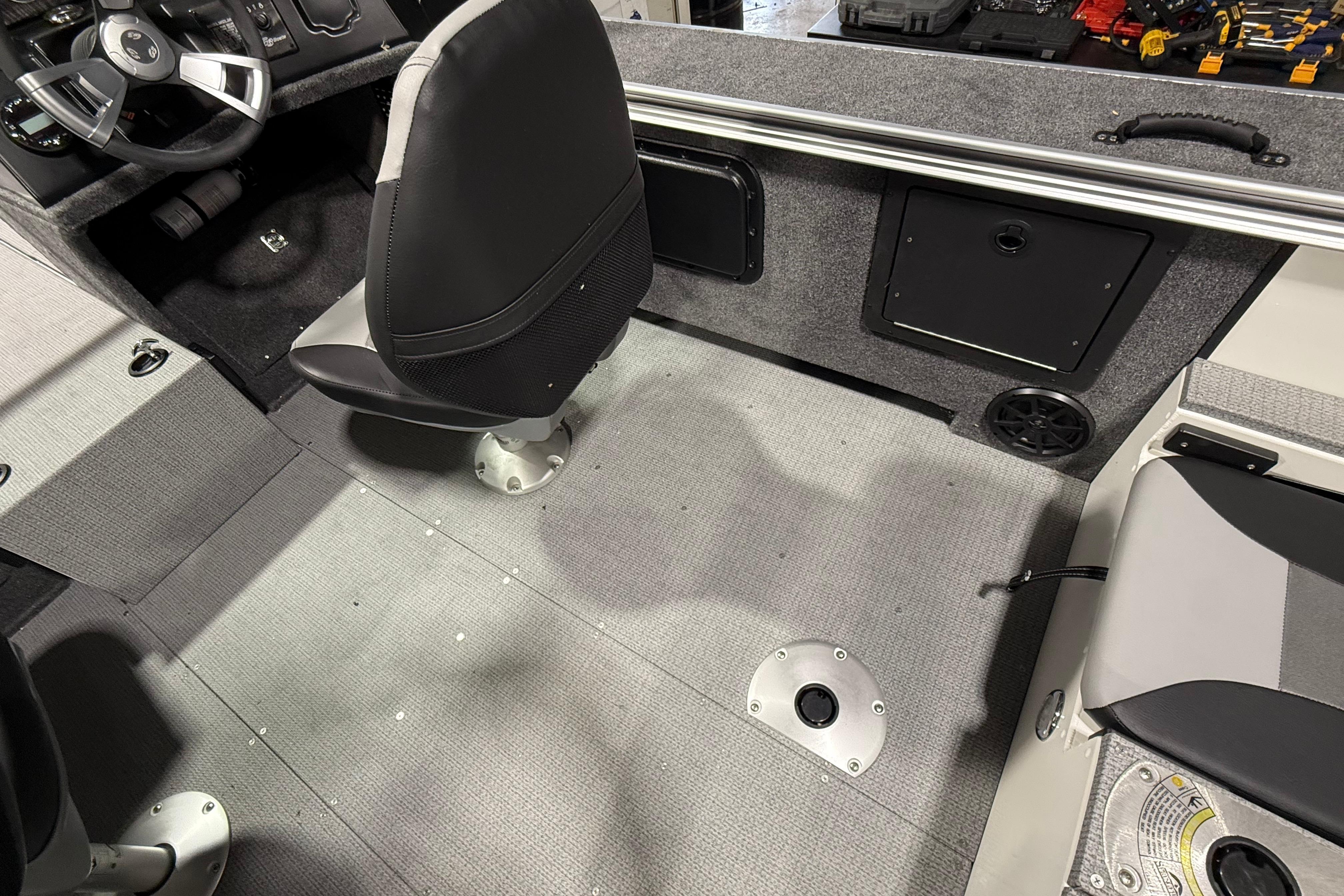 Interior of 2025 G3 Angler V1850 SF boat, featuring seating and storage compartments.
