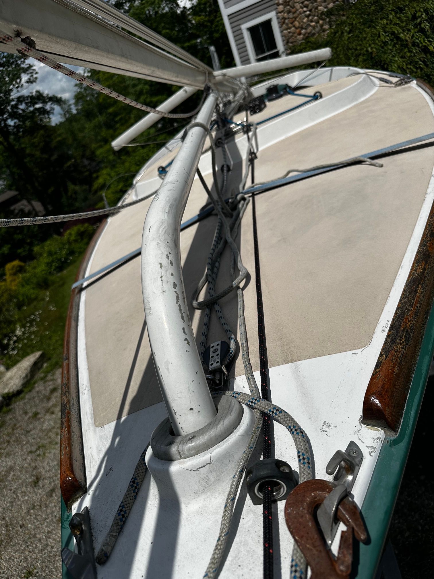 Close-up of an Alerion Express 20 sailboat deck with rigging and ropes.