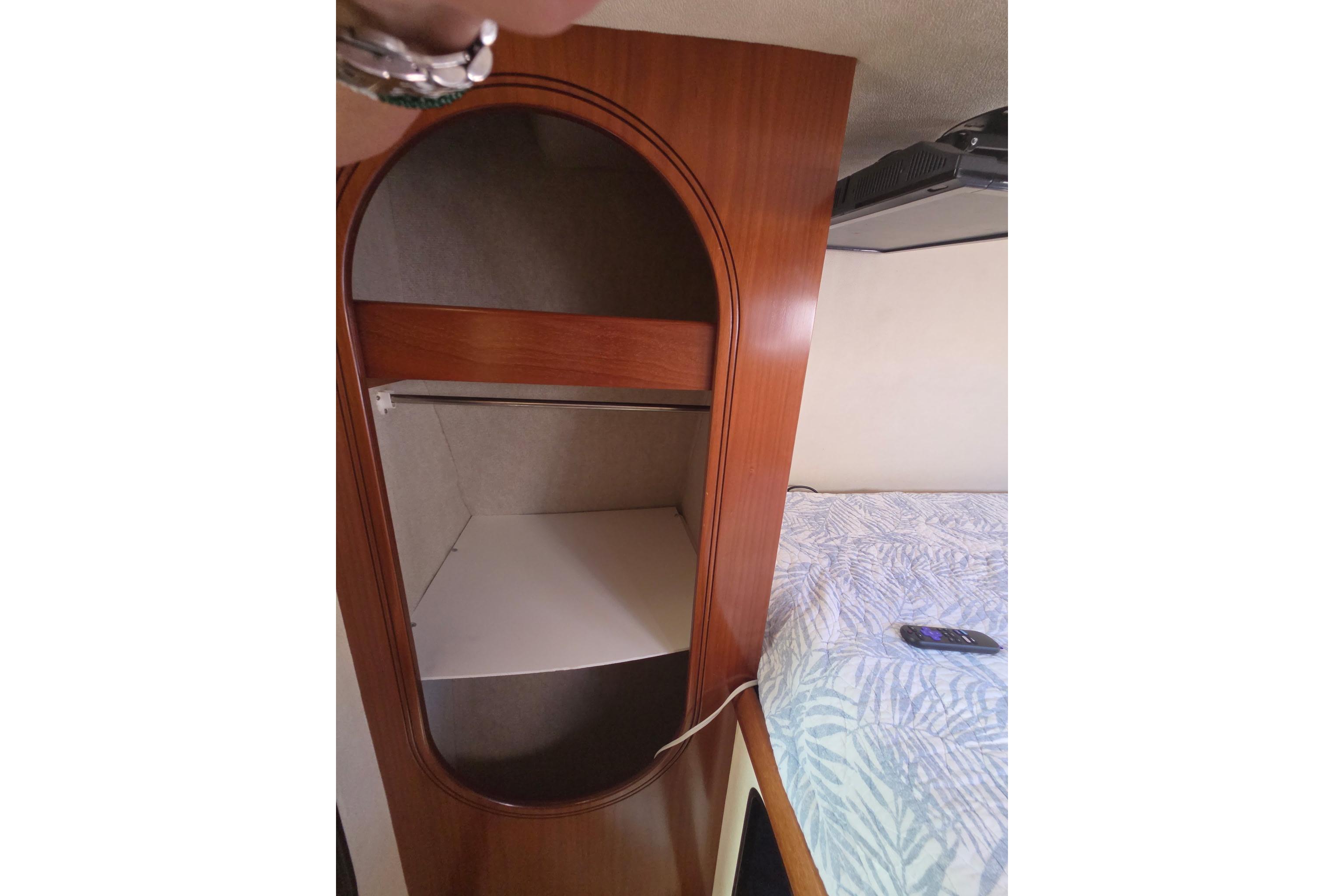 Interior of 2000 Fountaine Pajot Maryland 37 with wooden cabinet and bed.