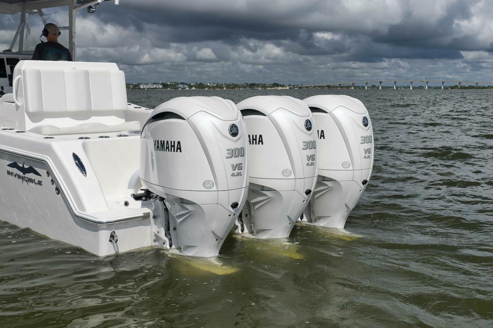 2018 Invincible 36' Open Fisherman with triple Yamaha 300 V6 engines on water.