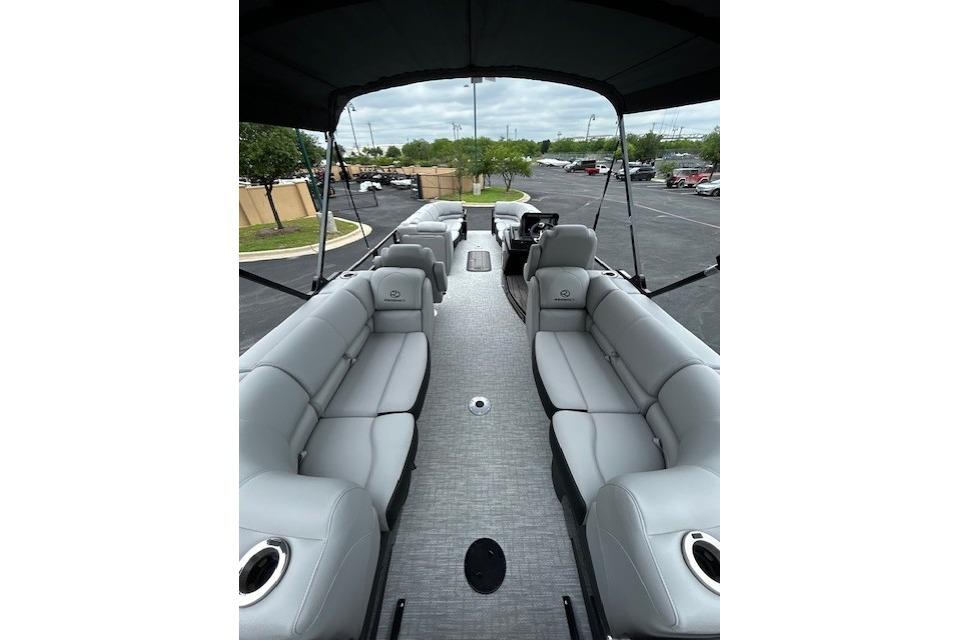 2026 Regency 250 DL pontoon boat interior with gray seating and canopy.
