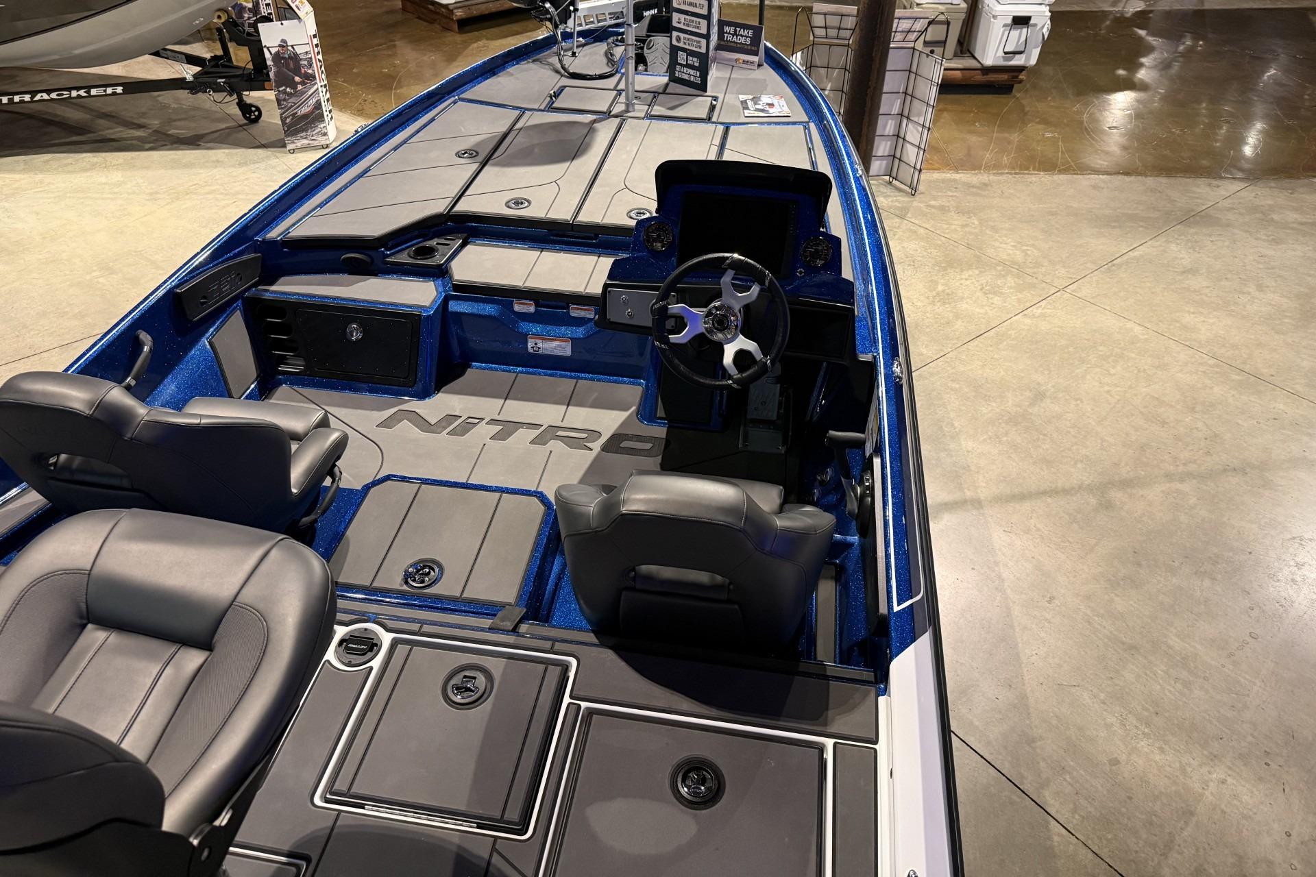 2026 Nitro Z21 XL Pro boat interior with steering wheel and seating.