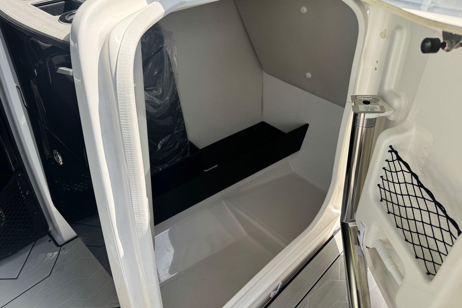 2023 Yamaha Boats 252XE interior storage compartment with sleek design and modern features.