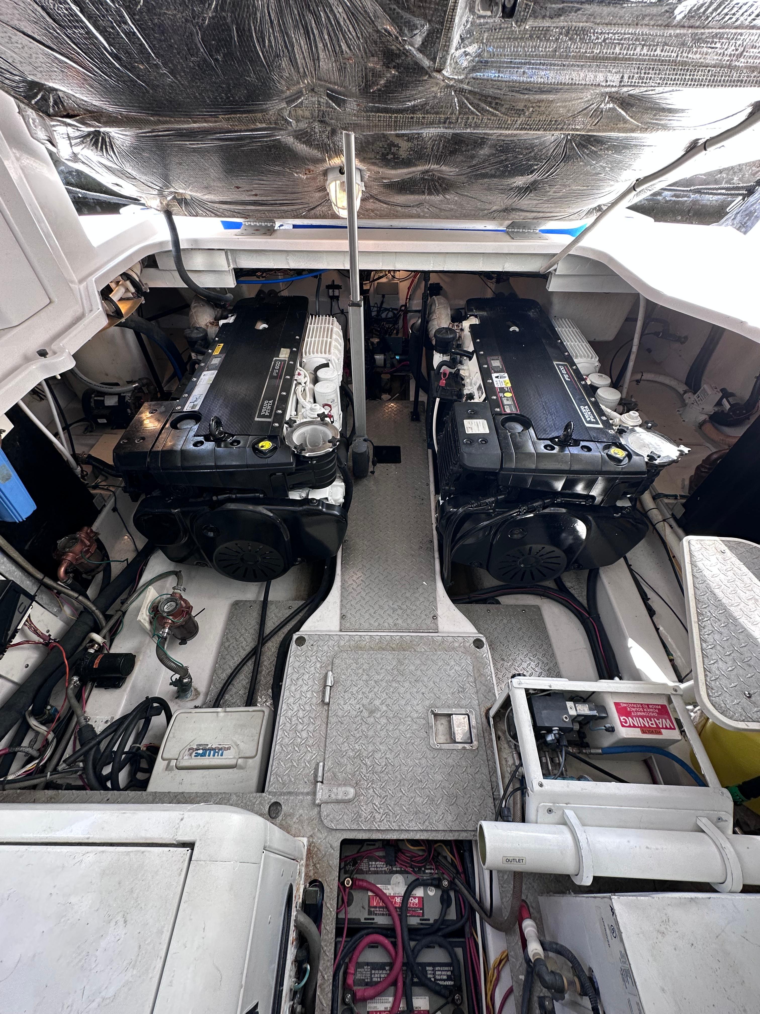 Engine room of a 2008 Four Winns V458 boat, featuring dual engines and mechanical components.