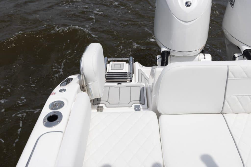 2027 Sea Fox 268 Commander boat interior with white seating and dual engines.