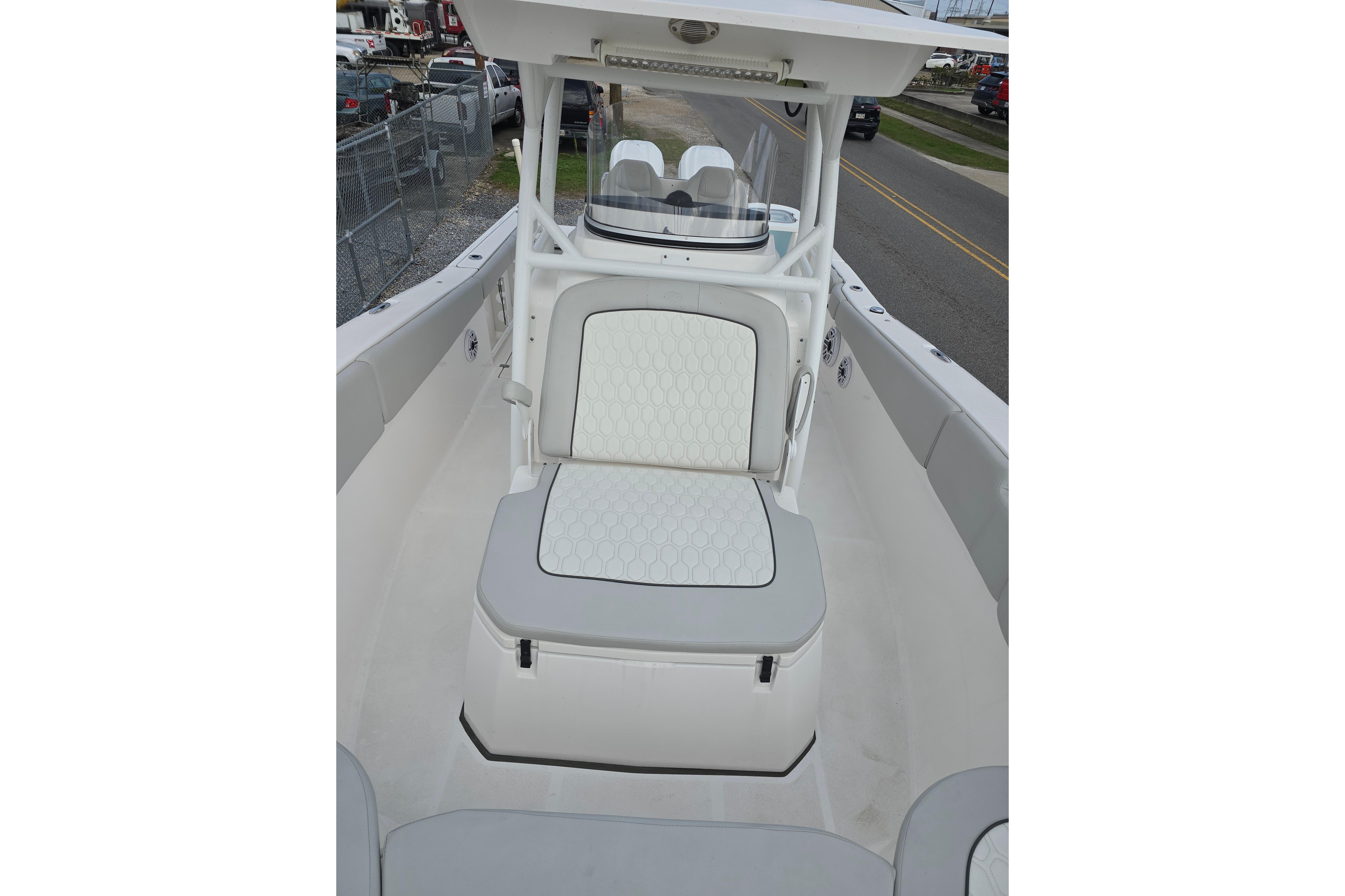 2023 Sea Fox 288 Commander boat interior with cushioned seating and helm station.
