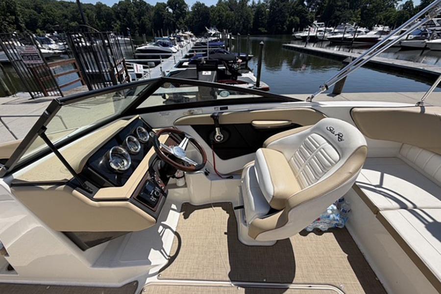 Interior of a 2018 Sea Ray SPX 190 boat at a marina dock.