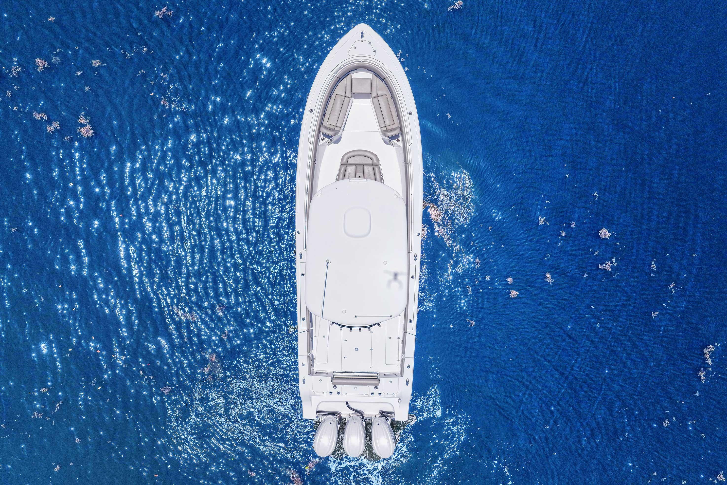 2024 Sportsman Open 352 Center Console boat on sparkling blue ocean.