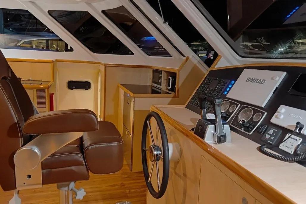 Interior of 2025 Rapido 500 ECO Power Cat cockpit with steering wheel and control panel.