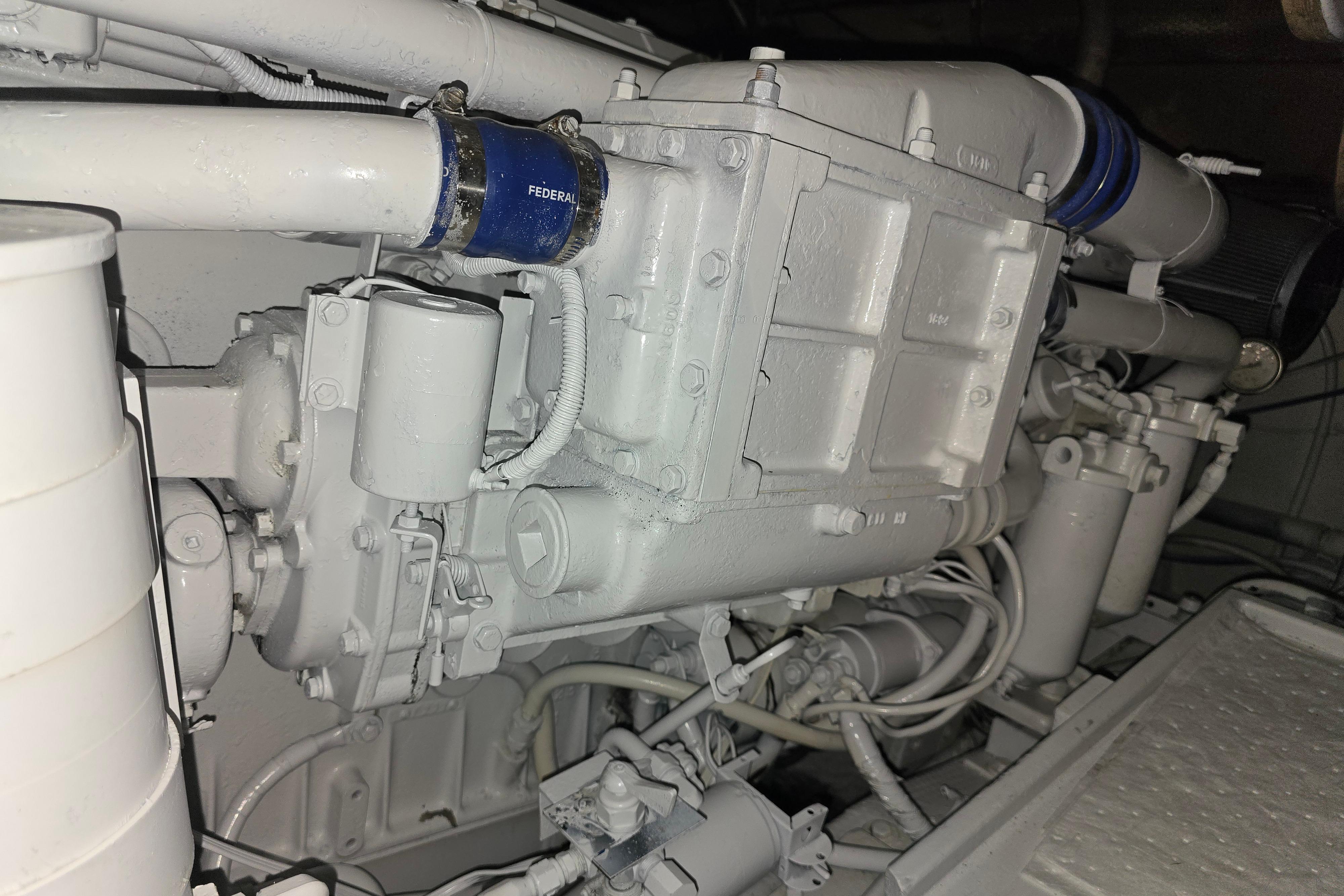 Engine compartment of a 1988 Post 46 Convertible boat, showcasing mechanical components.
