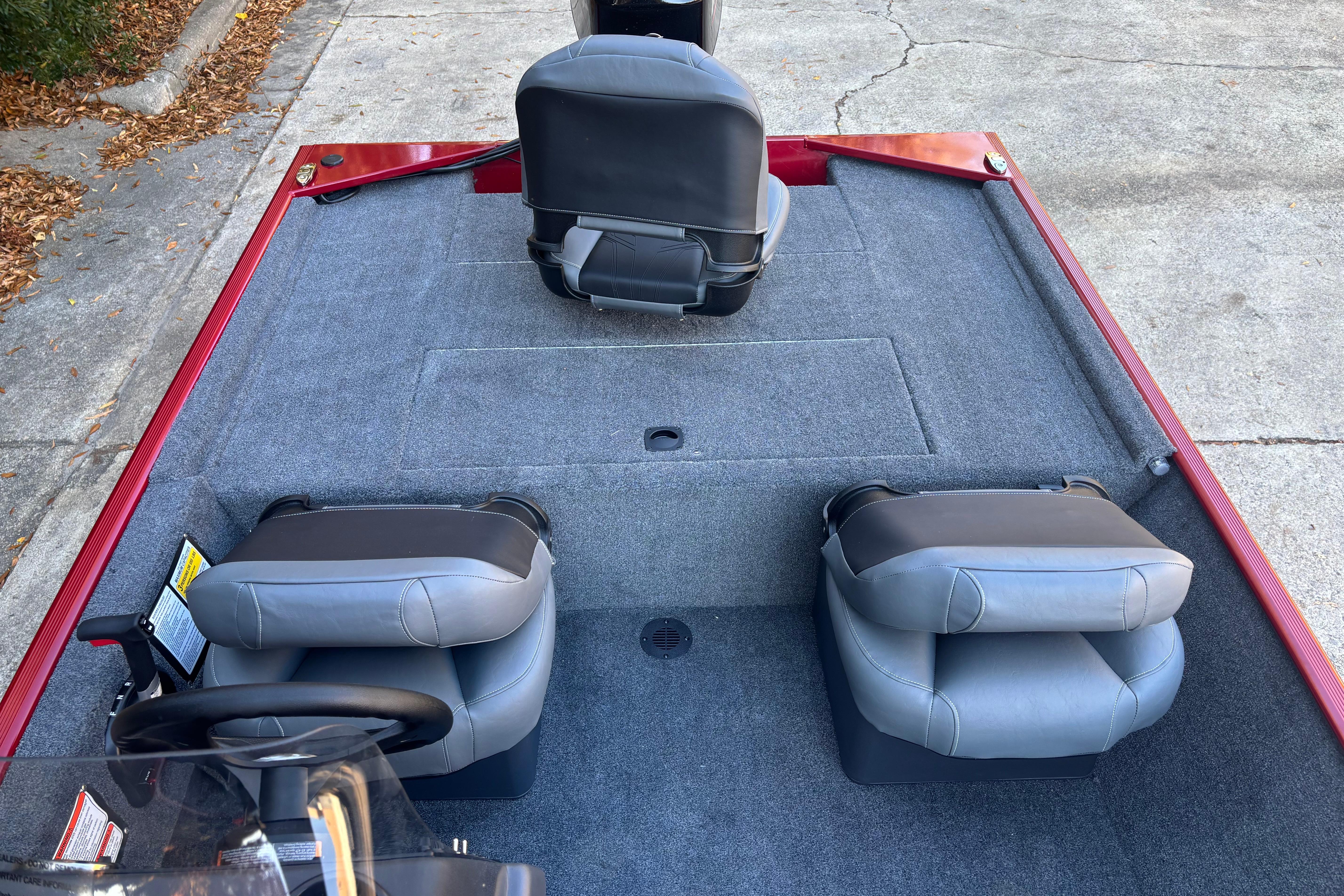 2026 Tracker Bass Tracker Classic XL boat interior with gray seating and carpeted deck.