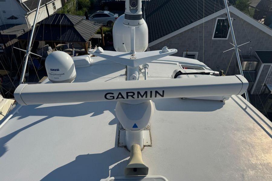 Radar equipment on 2002 Viking 61 Enclosed Bridge yacht with Garmin and TracPhone systems.