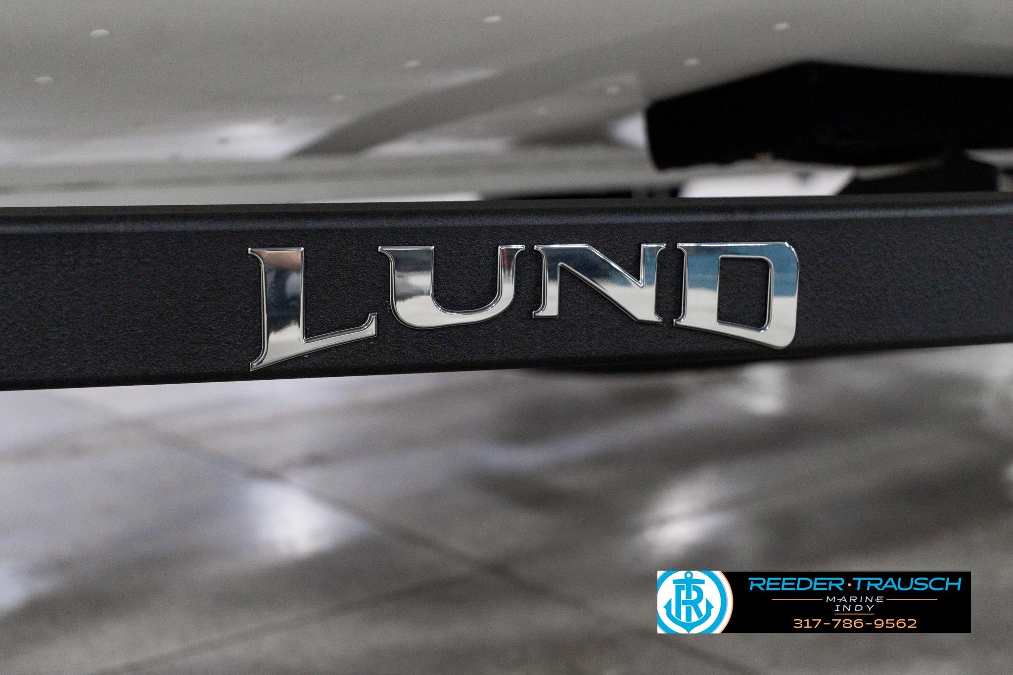 2026 Lund 1700 Explorer Sport boat logo on a black surface, showcasing brand detail.