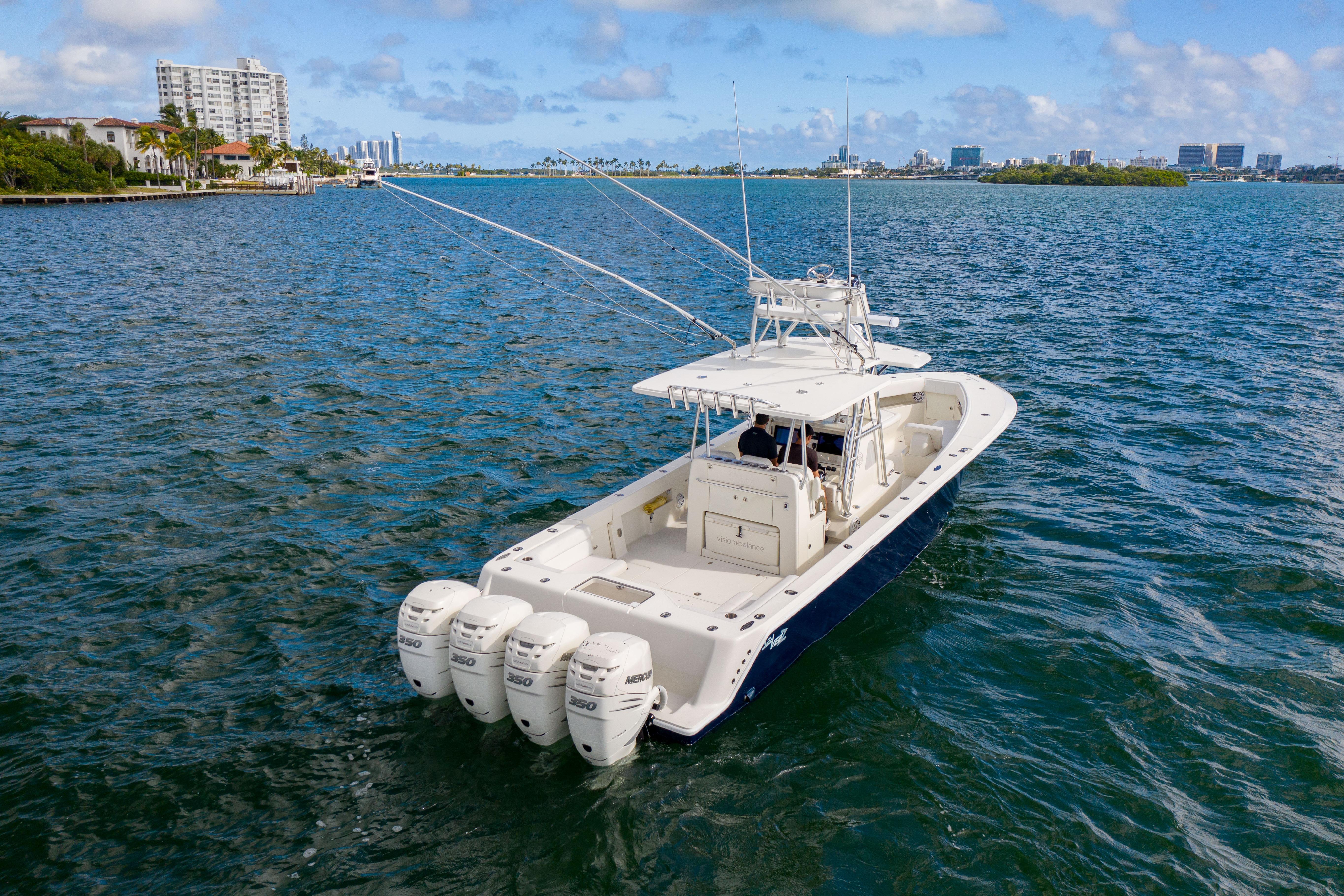 2017 SeaVee 390Z boat with four engines cruising on a sunny day.