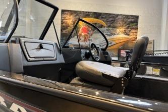 2026 Tracker Pro Guide V-16 WT boat interior with steering wheel and seating.