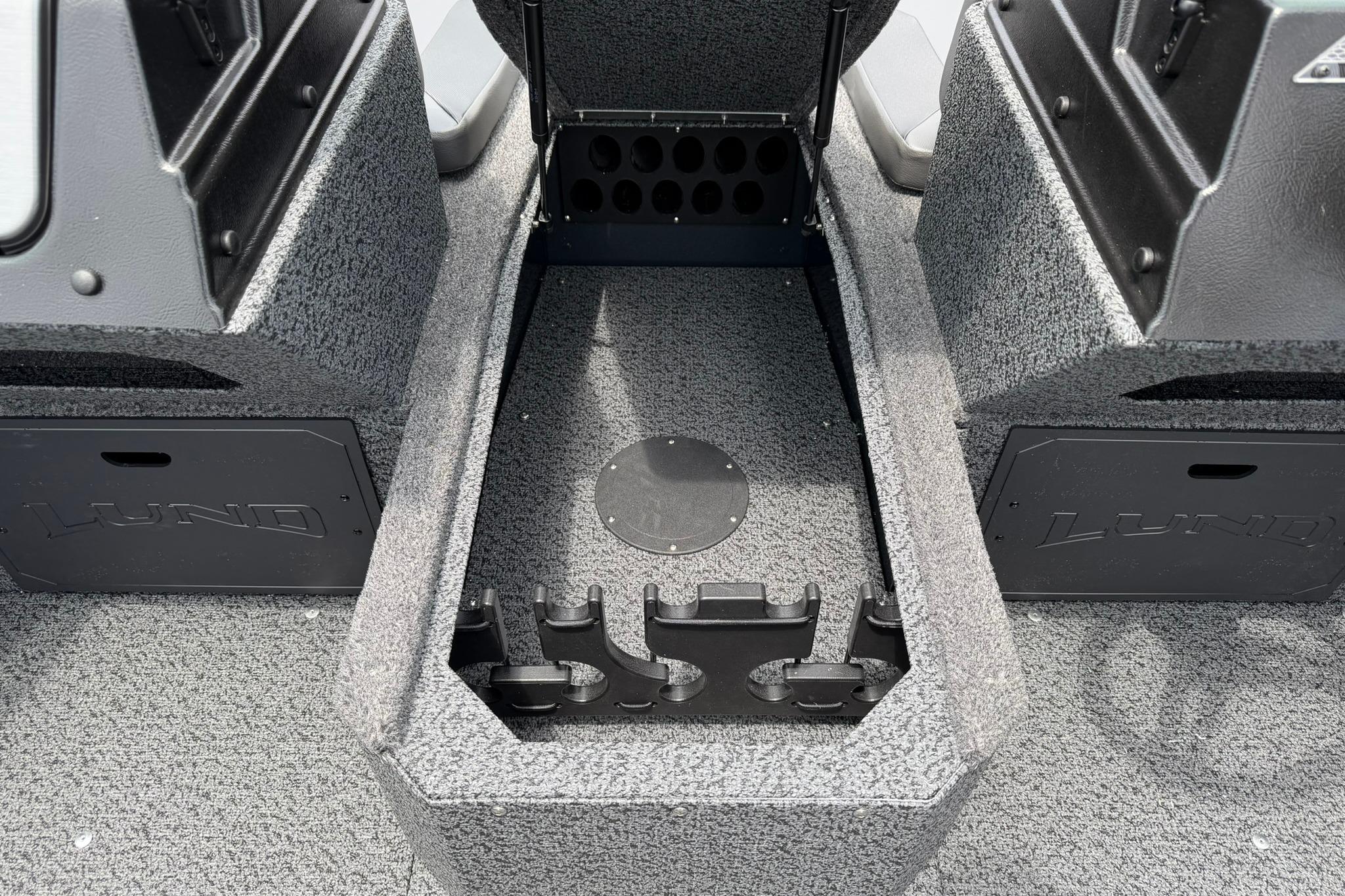 Interior view of 2027 Lund 1675 Adventure Sport boat, featuring storage compartments.