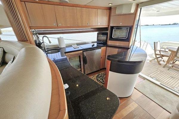 Luxurious kitchen interior of 2005 Sunseeker Manhattan 66 yacht with ocean view.