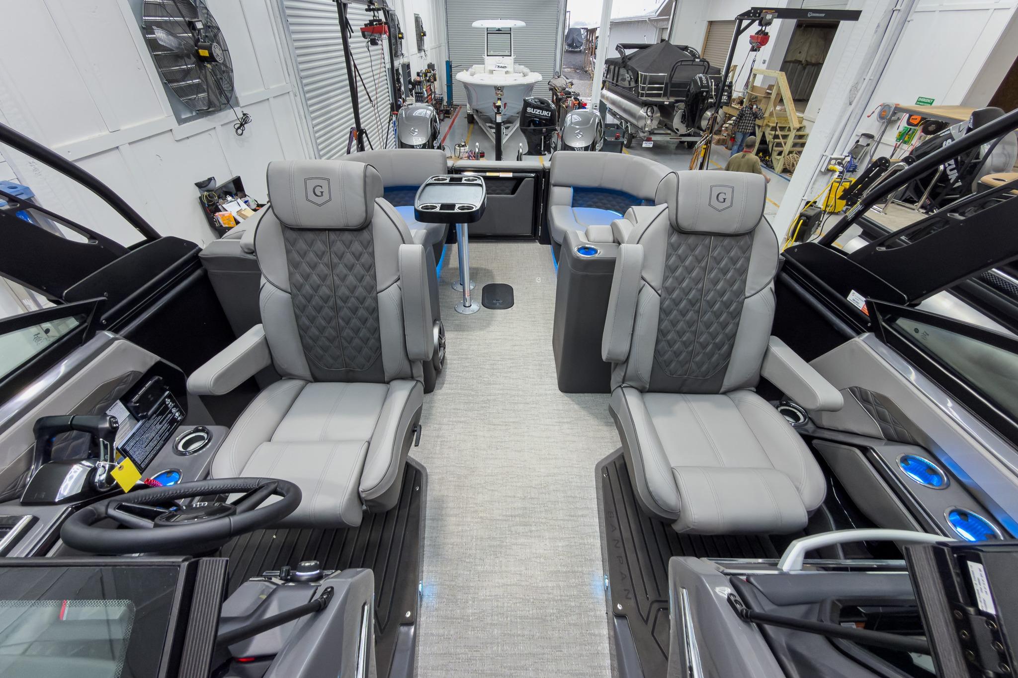 Luxurious interior of 2026 Godfrey Sanpan 27' Tritoon with plush seating and modern design.