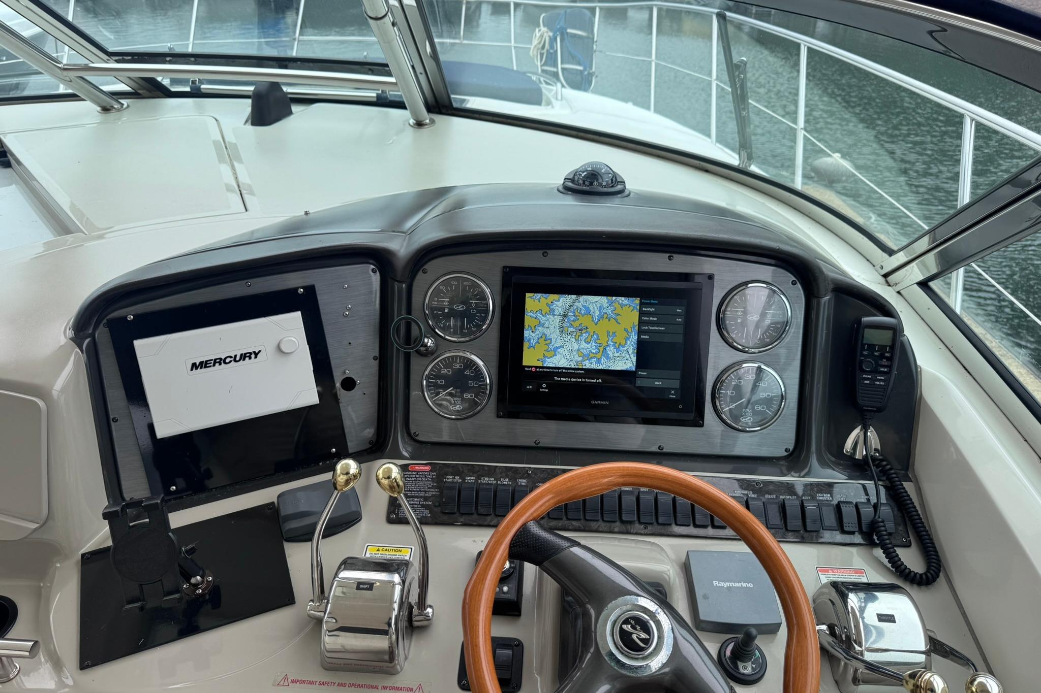 Cockpit of 2004 Sea Ray 390 Sundancer with navigation system and controls.