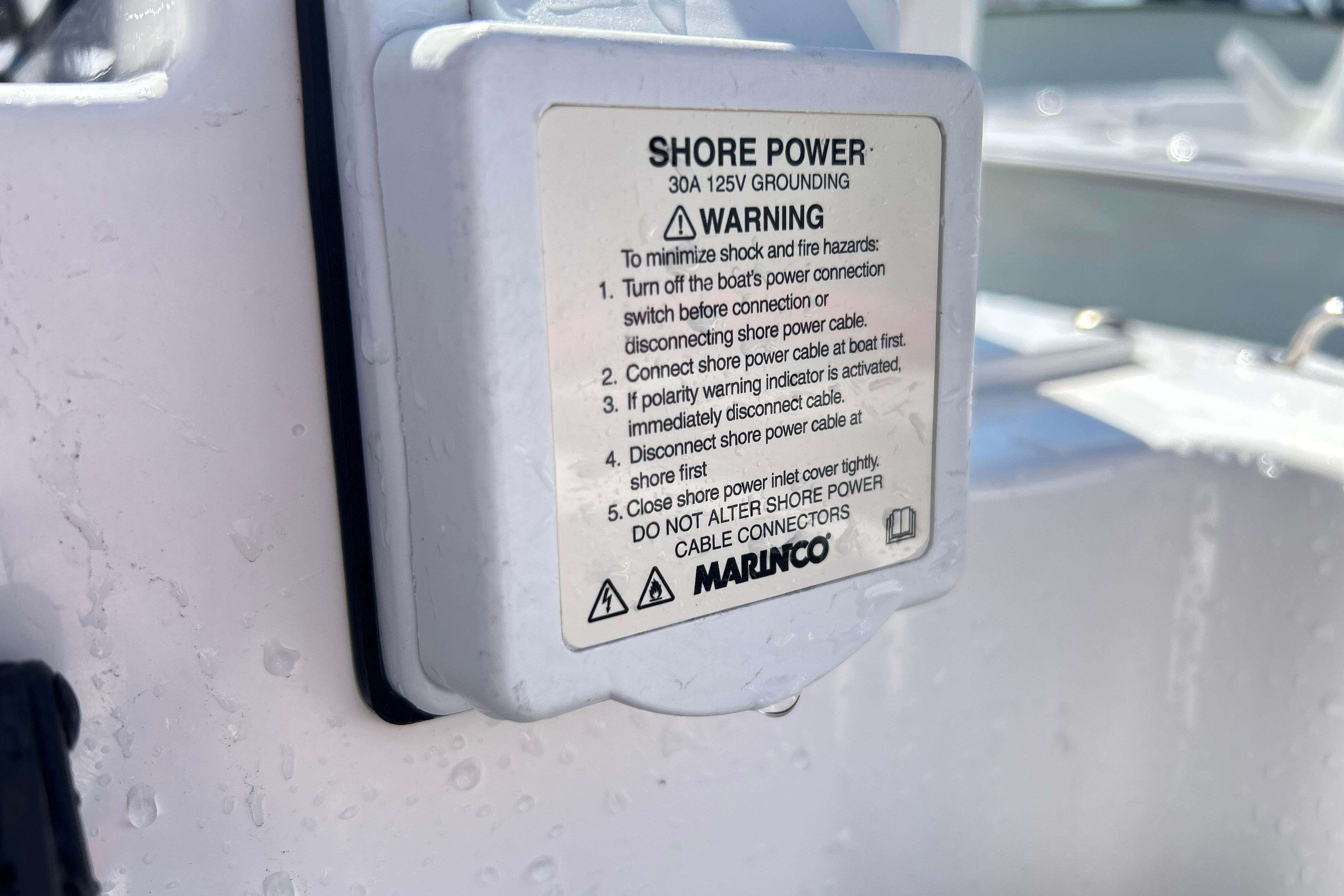 Shore power warning label on 2025 Sea Fox 288 Traveler boat.