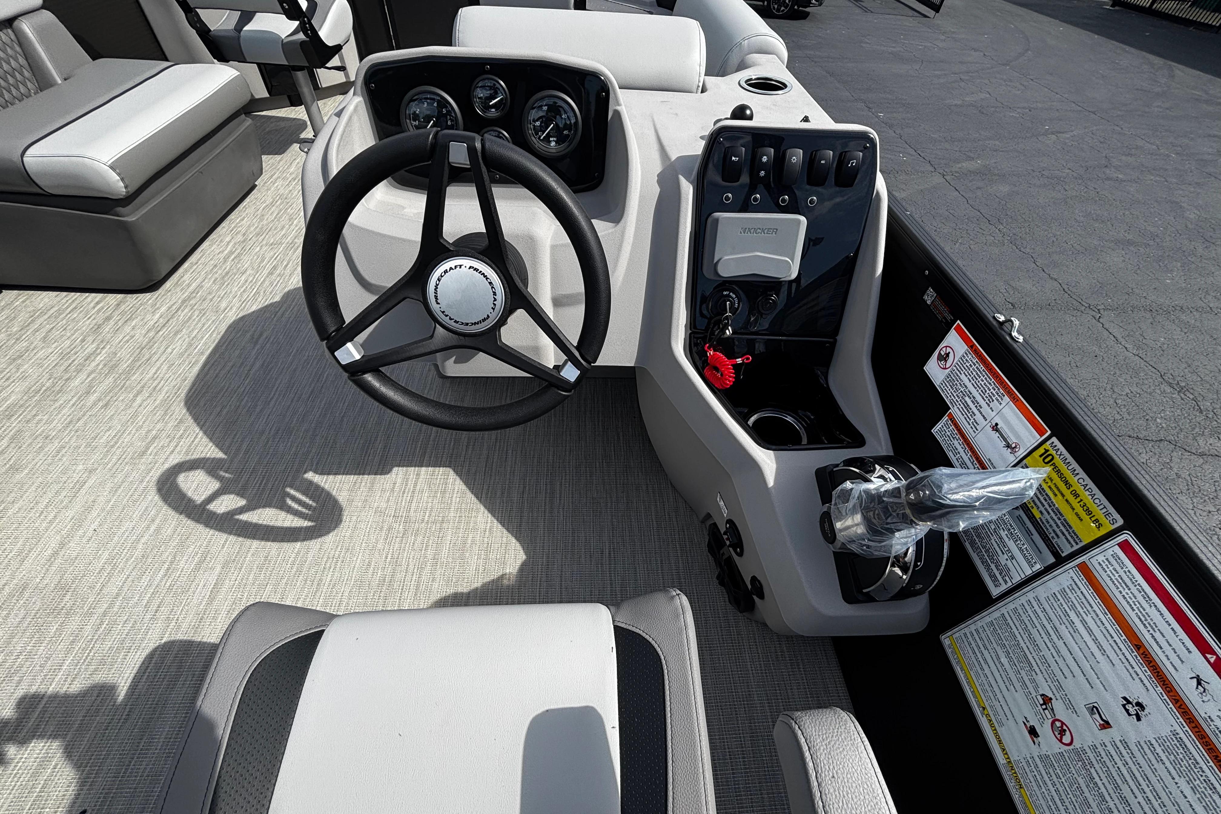 2026 Princecraft Sportfisher 21-2S boat interior with steering wheel and control panel.