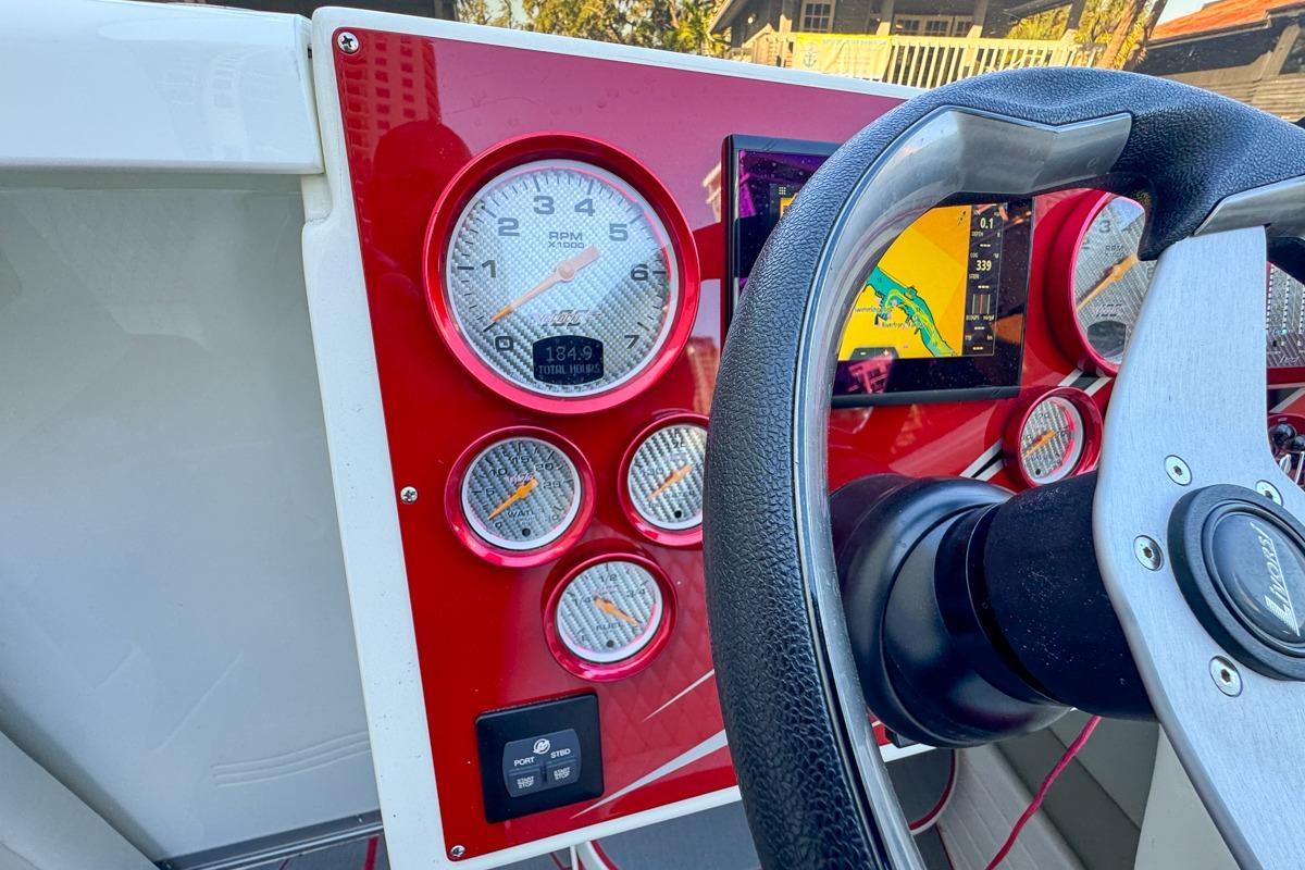 Dashboard of a 2022 Velocity 290sc boat with gauges and navigation screen.