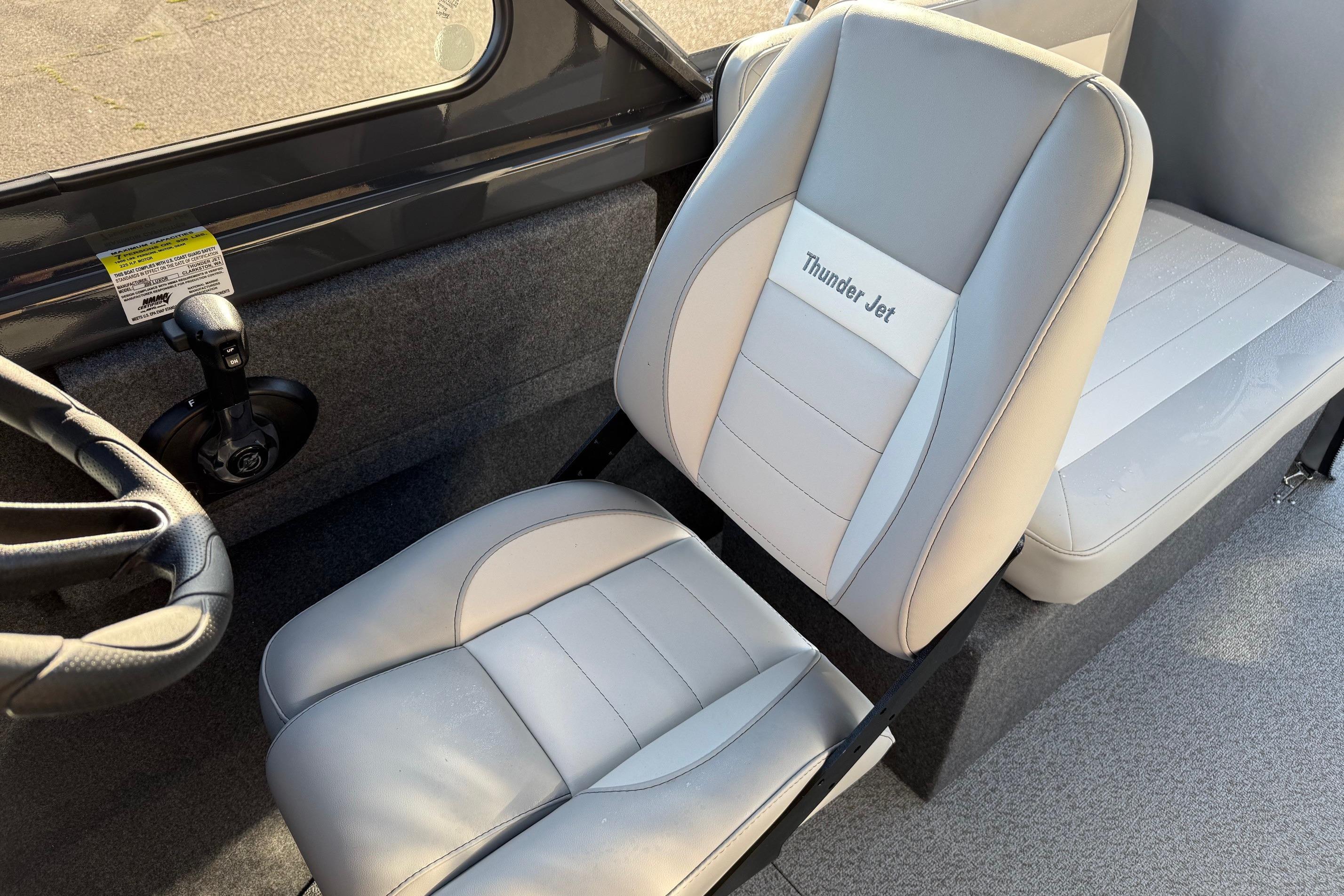 2026 Thunder Jet 200 Luxor boat interior with gray seating and steering wheel.