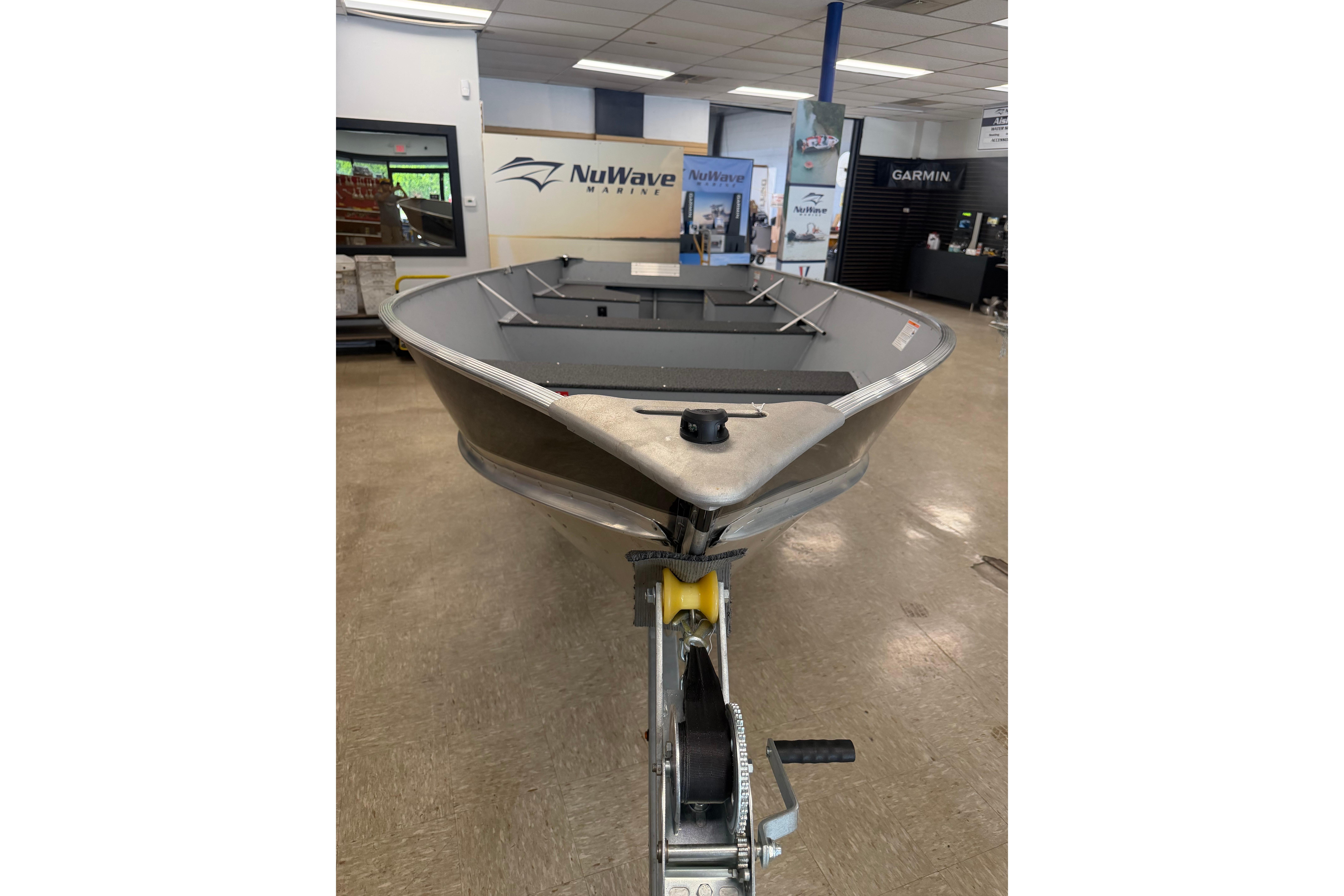 2027 Lund WC 16 boat displayed indoors at NuWave Marine showroom.