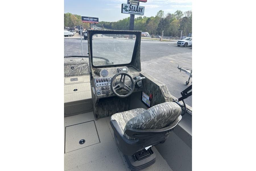 2025 SeaArk Predator 300 AK boat interior with steering wheel and camo seat.