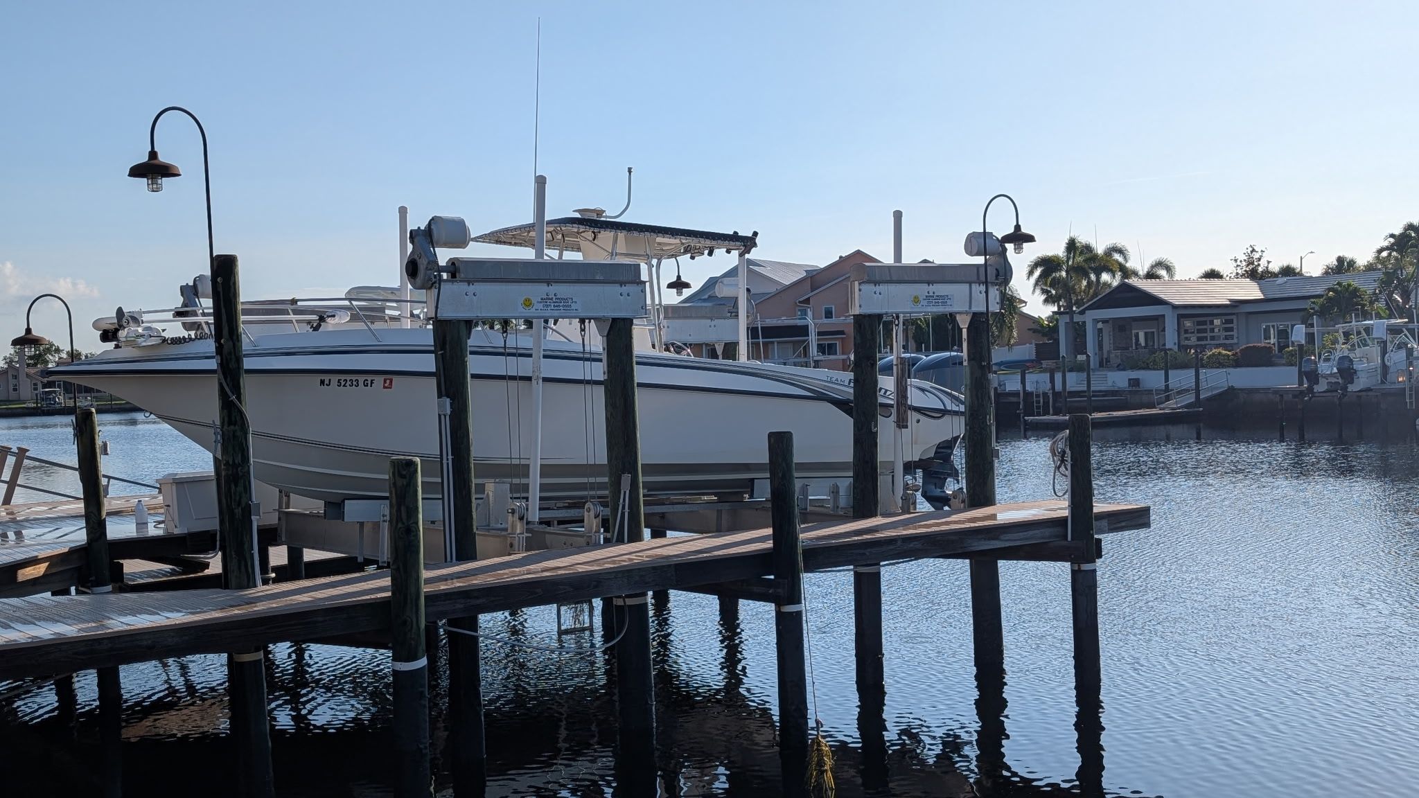 1997 Fountain Center Console boat docked at marina.