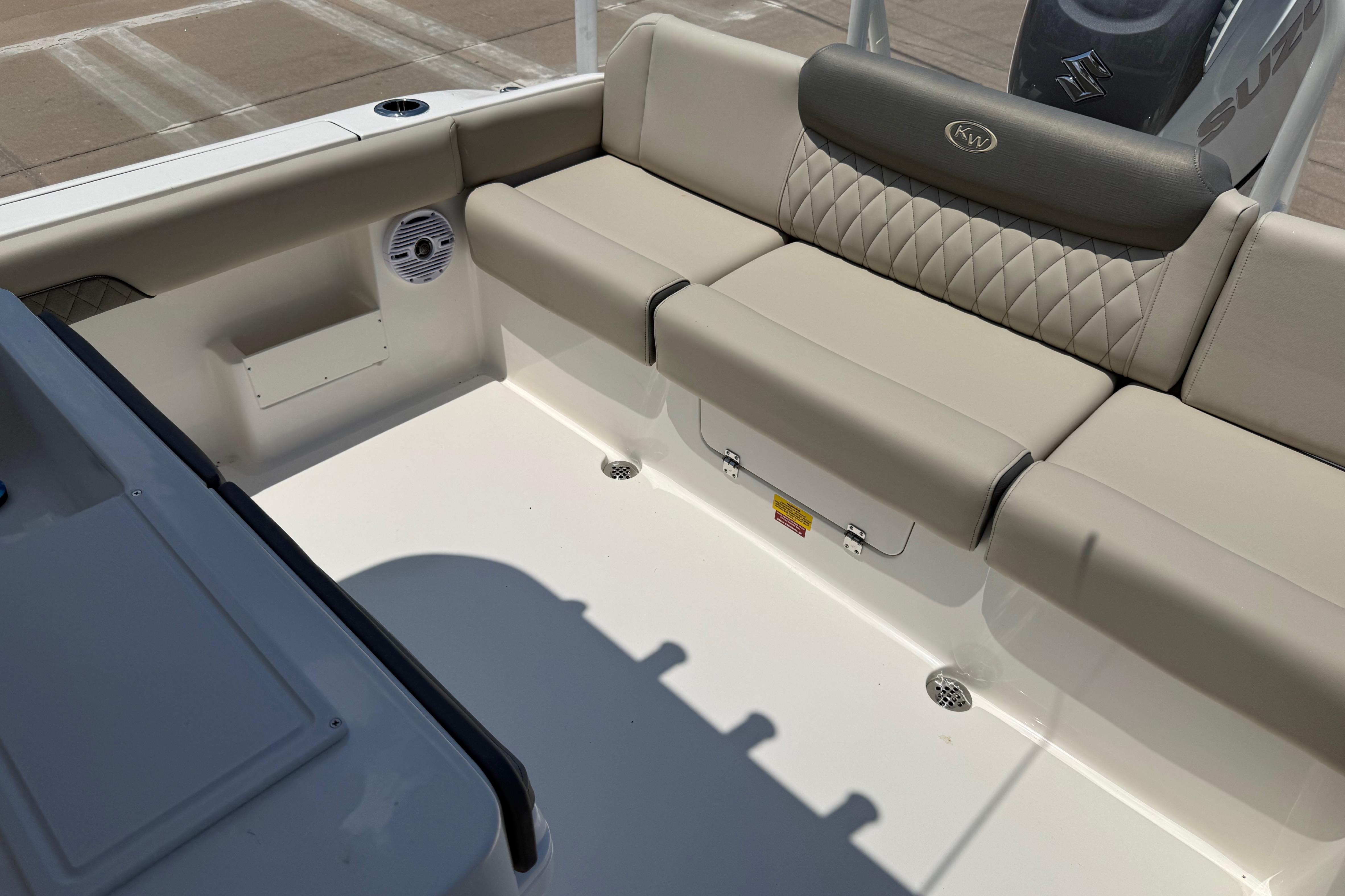 2027 Key West 249 FS boat interior with cushioned seating and speaker.
