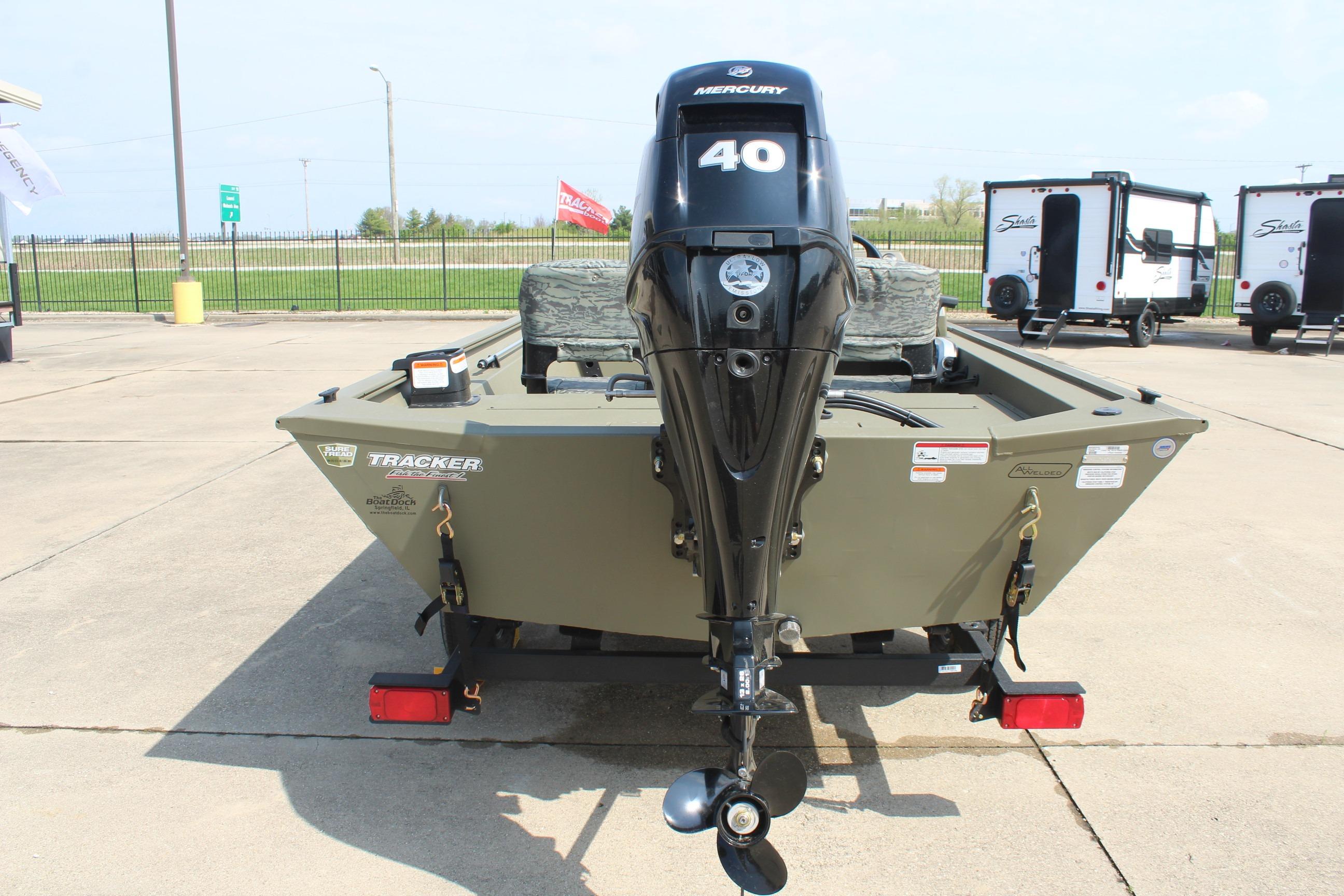 2026 Tracker Grizzly 1754 SC boat with Mercury 40 outboard motor, parked outdoors.