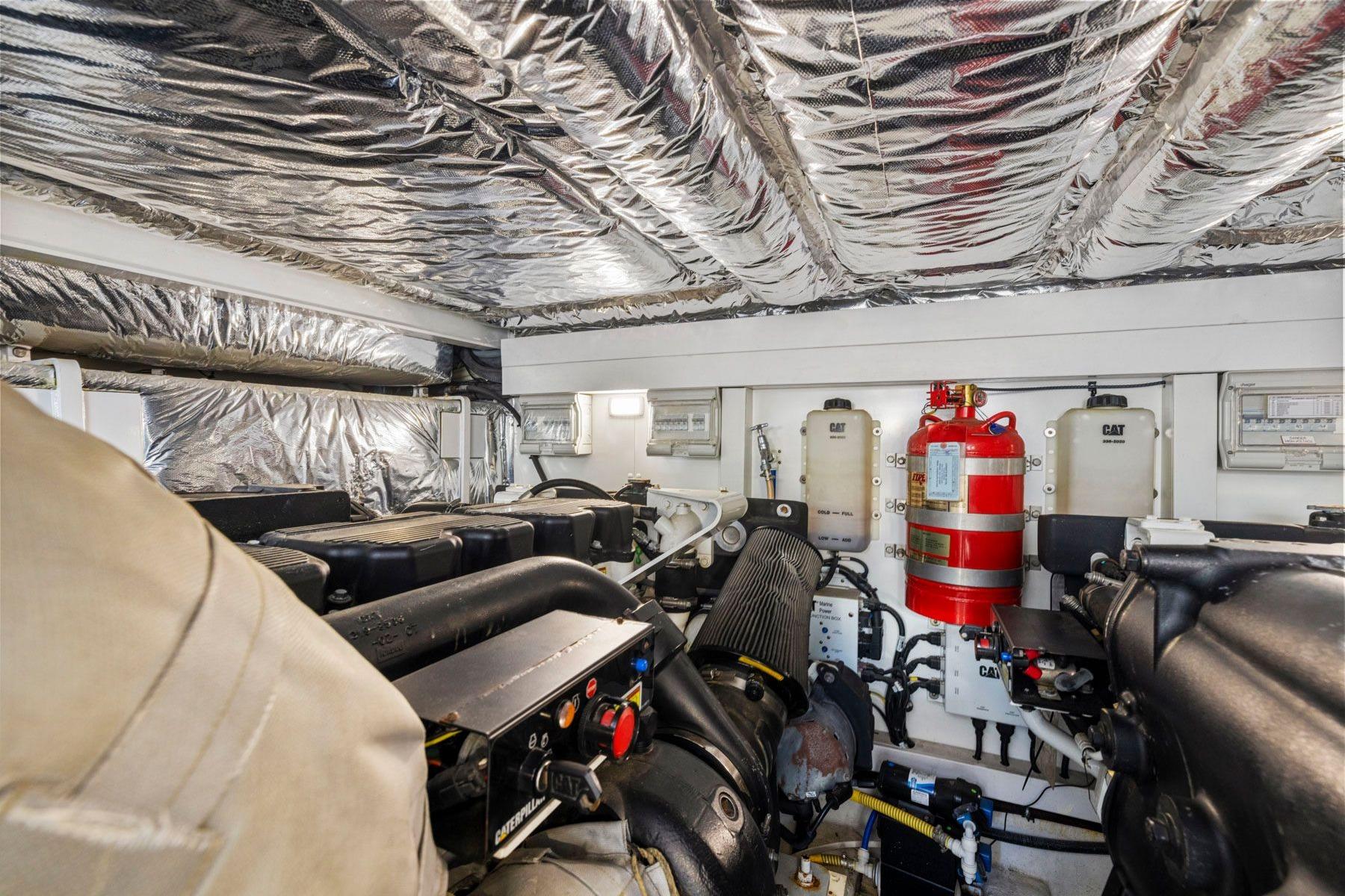 Engine room of 2015 Princess 60 Flybridge Motor Yacht with Caterpillar engines and fire suppression system.