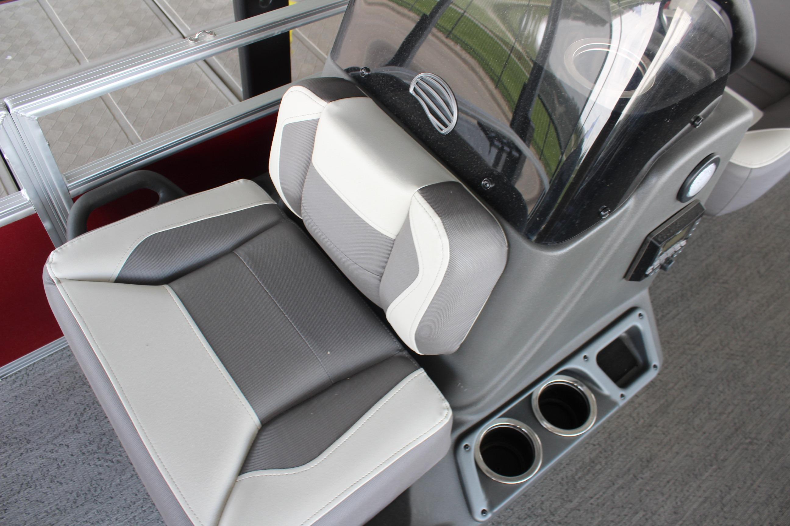 2026 Sun Tracker Bass Buggy 18 DLX boat seat and console with cup holders.