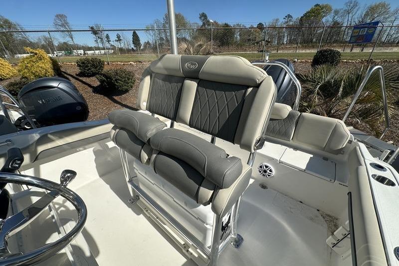 2026 Key West 219 FS boat interior with cushioned seating and steering wheel.