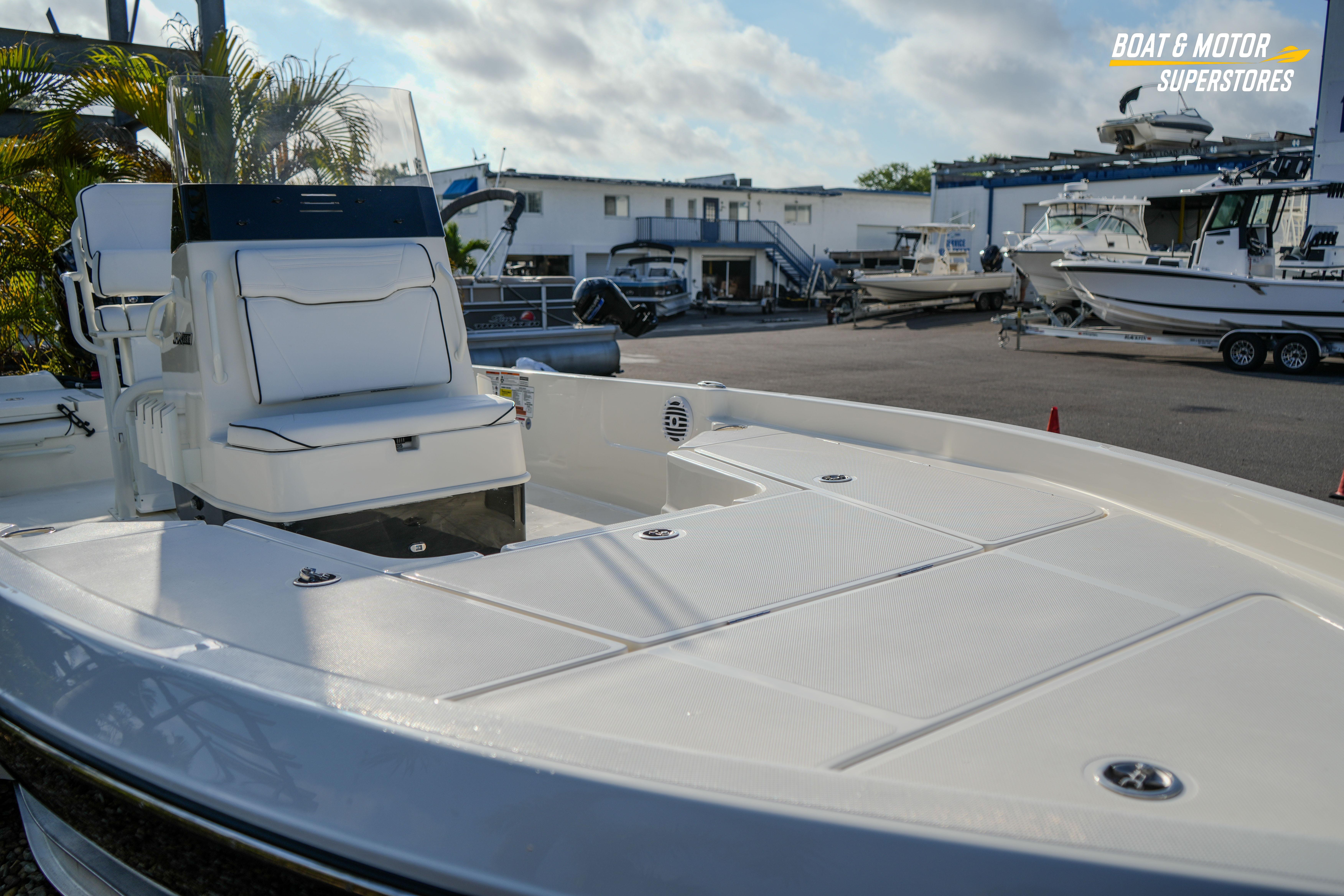 2026 Skeeter SX230 boat displayed at a marina with other vessels.