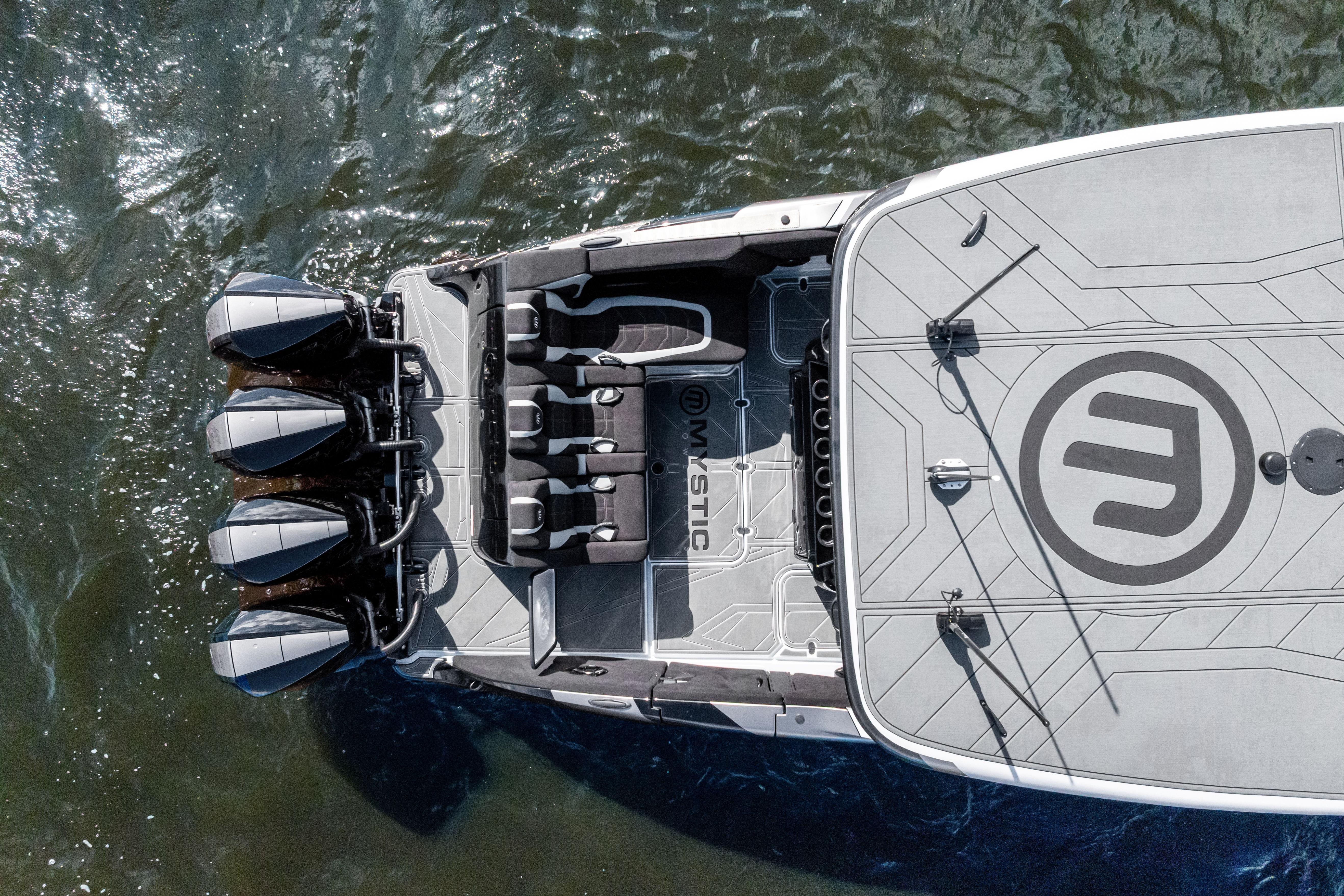 Top view of 2027 Mystic Powerboats M4200 on water, showcasing sleek design and powerful engines.