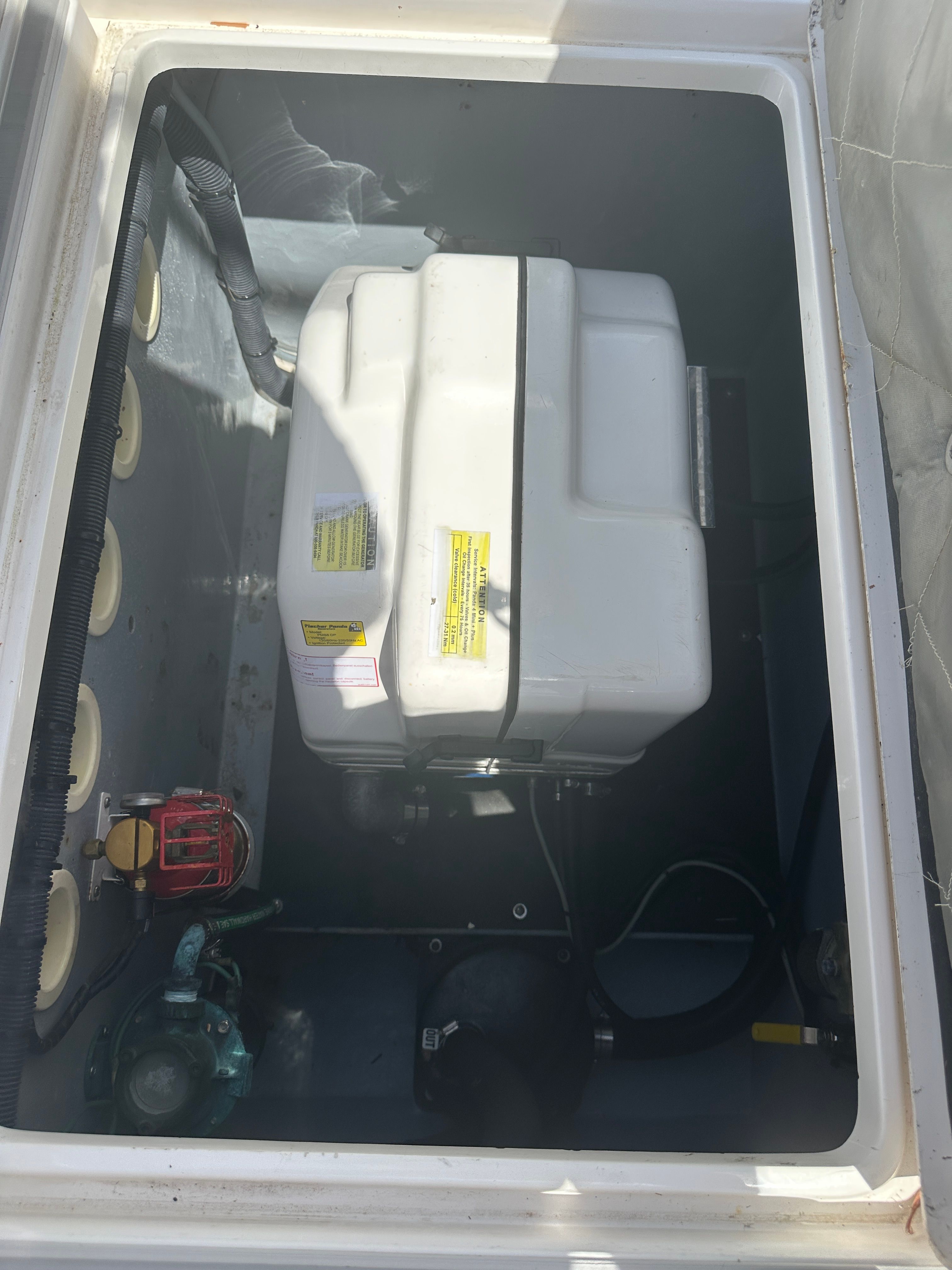 Generator compartment of a 2004 Intrepid 377 Walkaround boat.