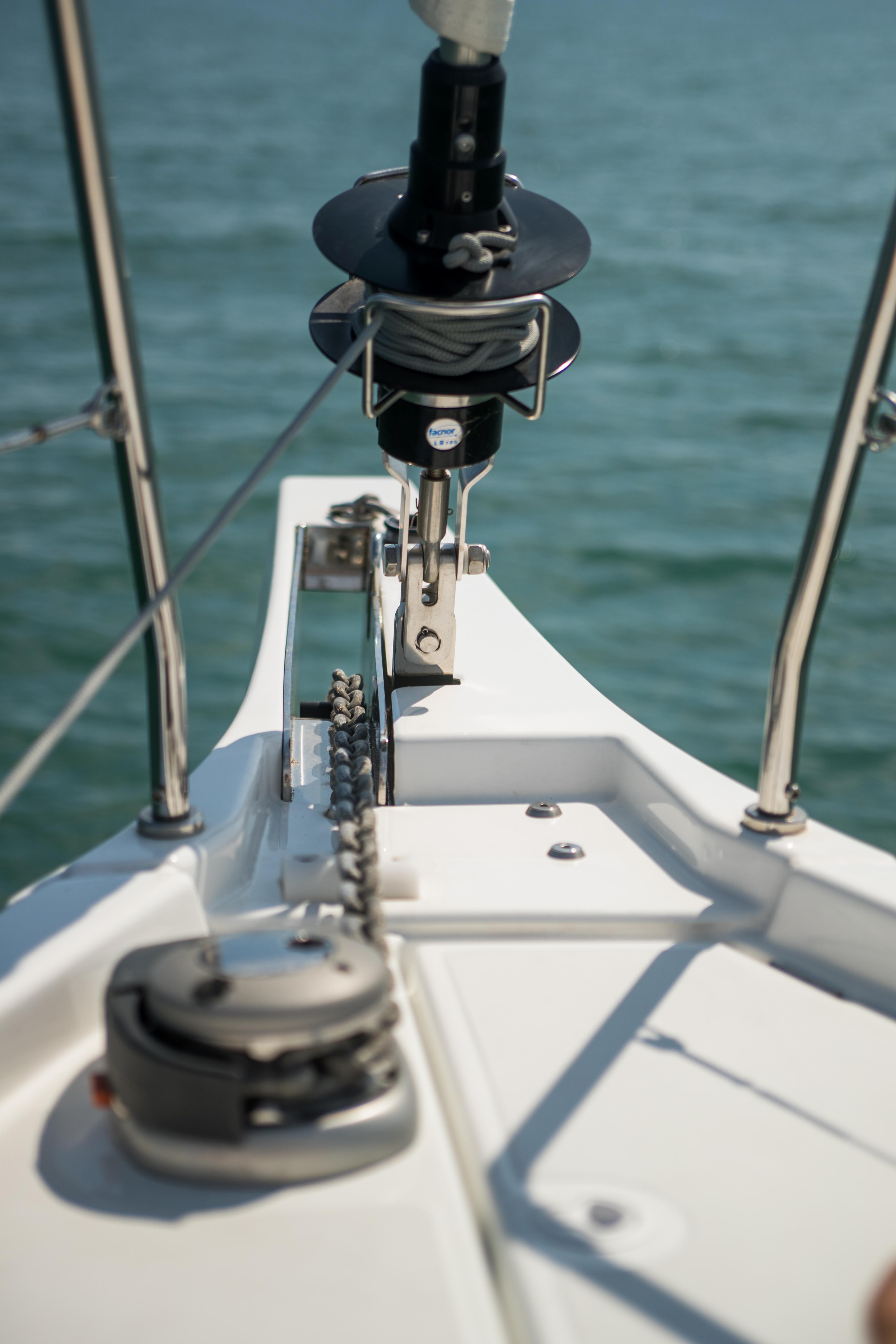 Bow of 2025 Beneteau Oceanis 40.1 sailboat on calm water.