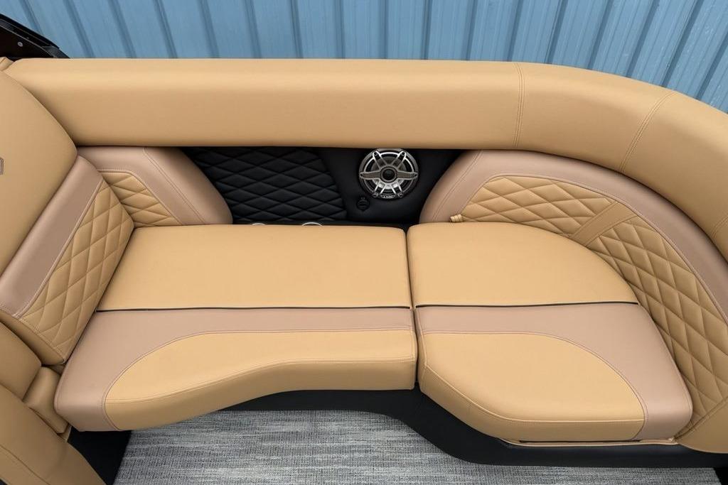 Luxurious tan seating on 2026 Godfrey Monaco 235 SFLC iMPACT boat with quilted design.