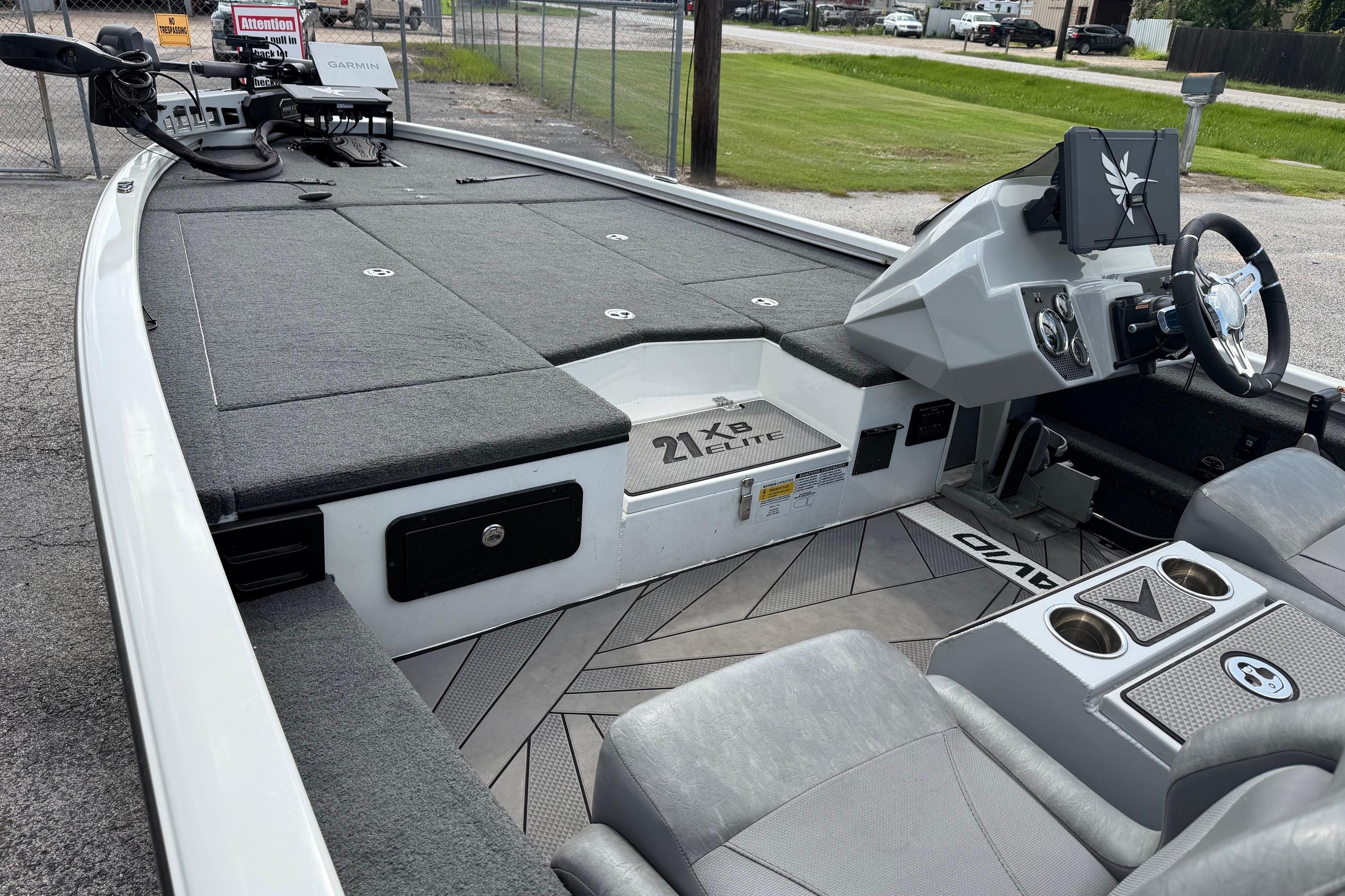 2024 Avid 21 XB Elite boat interior with modern dashboard and seating.