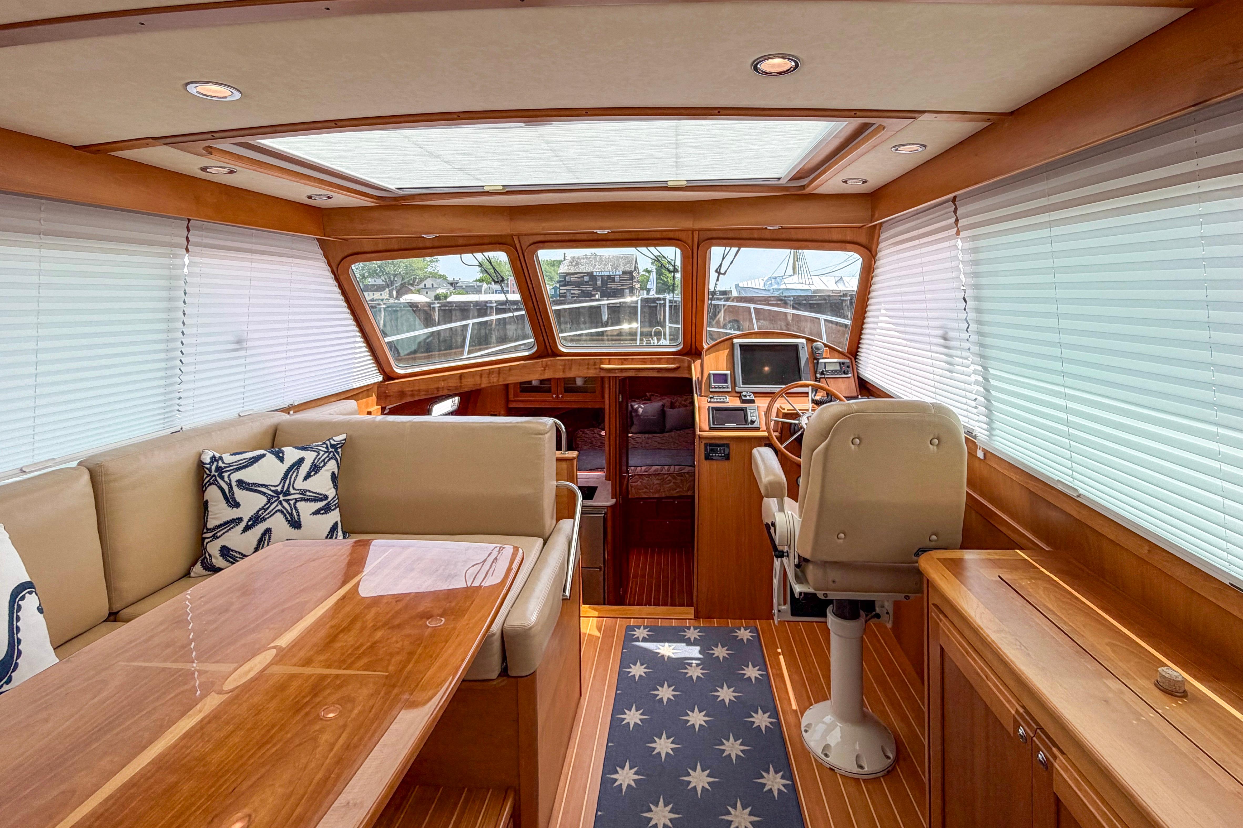 Luxurious interior of 2013 Sabre 38 Salon Express yacht with elegant wood finishes.