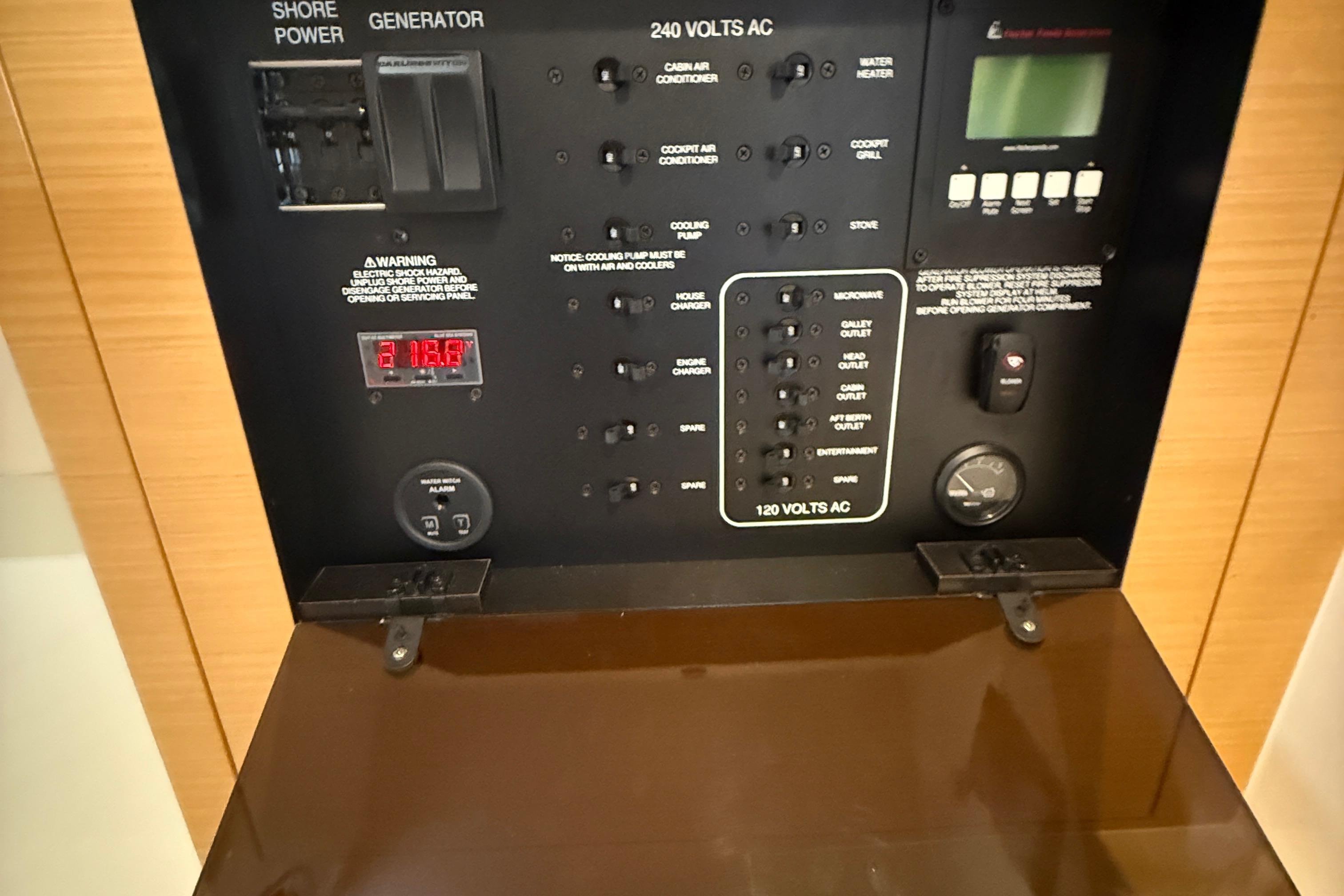 Control panel of a 2013 Pursuit SC 365i Sport Coupe, featuring various electrical switches.