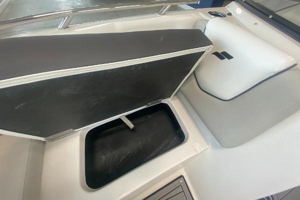2024 Starcraft SVX 190 boat with open storage compartment.