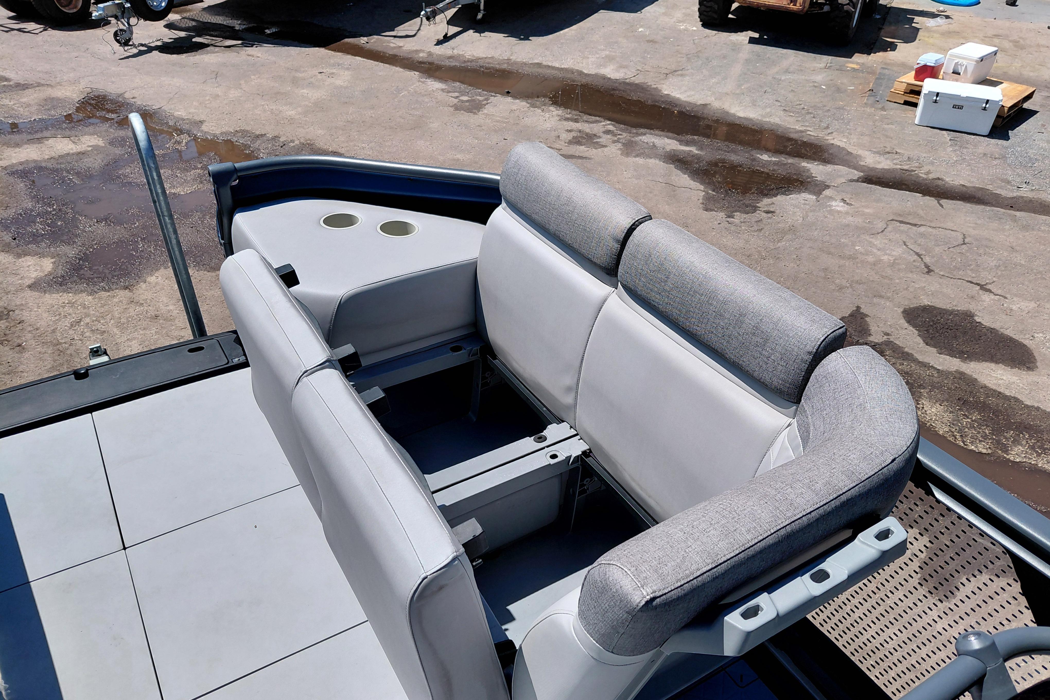 2024 Sea-Doo Switch Cruise 18 boat interior with gray seating and cup holders.