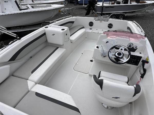 2024 Starcraft 171 SVX boat interior with seating and steering console, showcasing modern design.