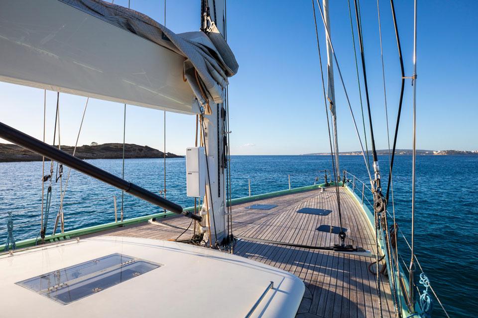 Sailing yacht YYachts Y8 2015 on open sea with clear blue sky.