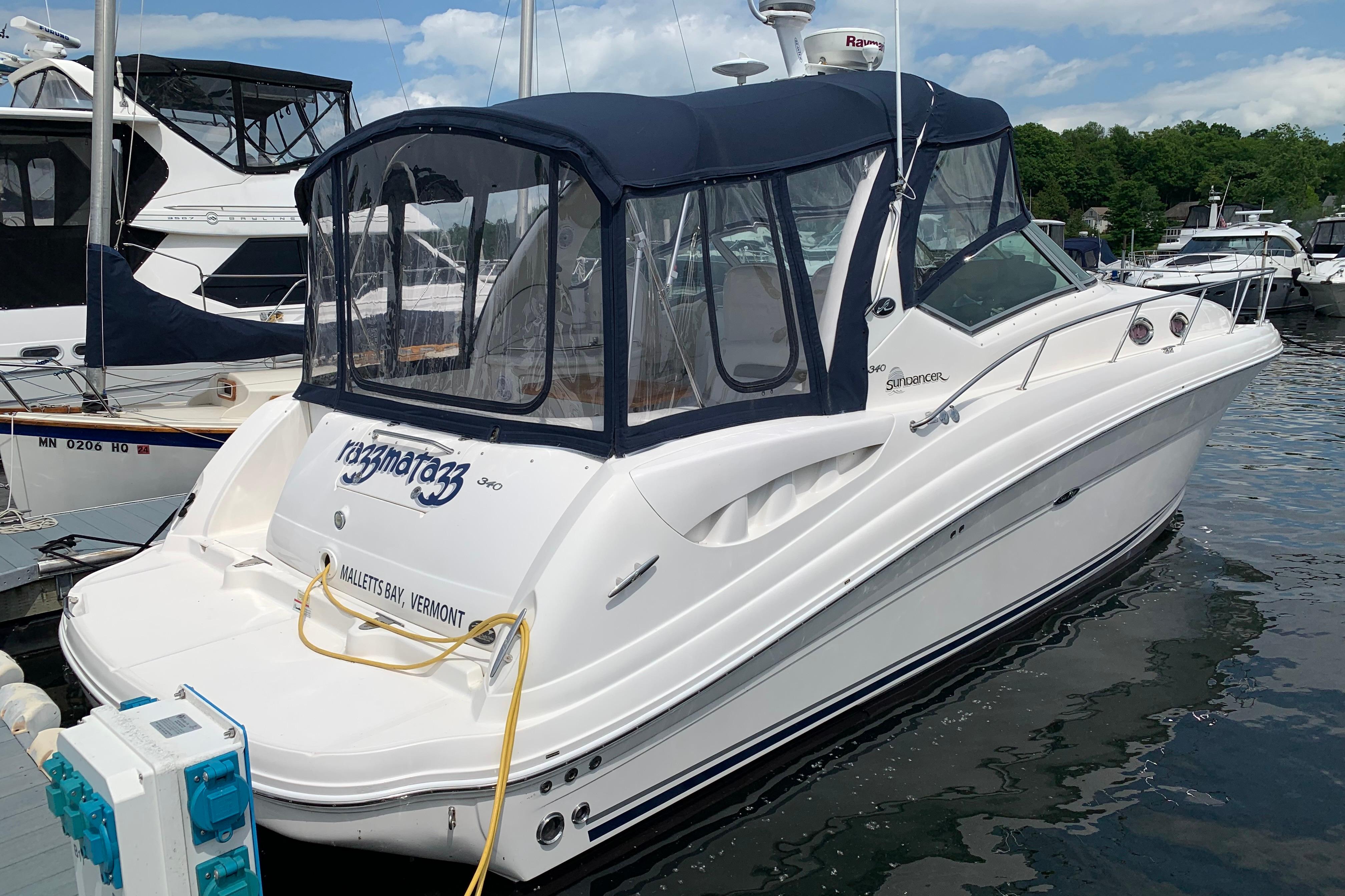 2007 Sea Ray 340 Sundancer docked in Malletts Bay, Vermont, with blue canopy.