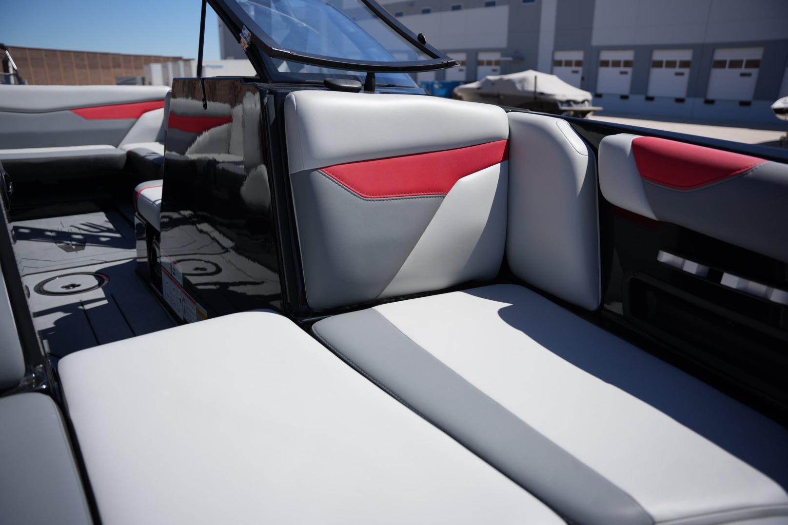 2019 Axis A22 boat interior with gray and red cushioned seating.