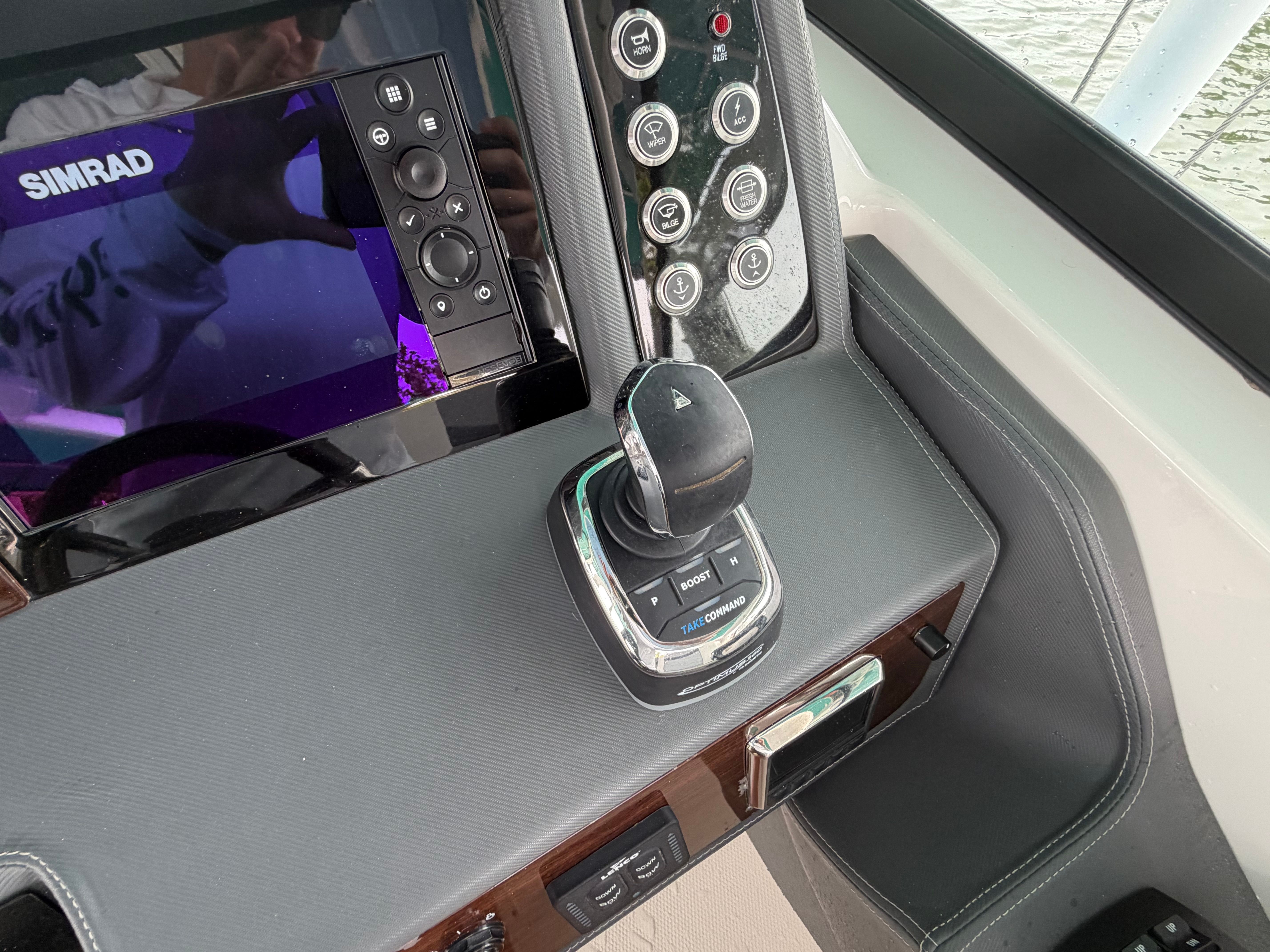 The cockpit of a Chaparral 280 OSX with controls and a display screen.
